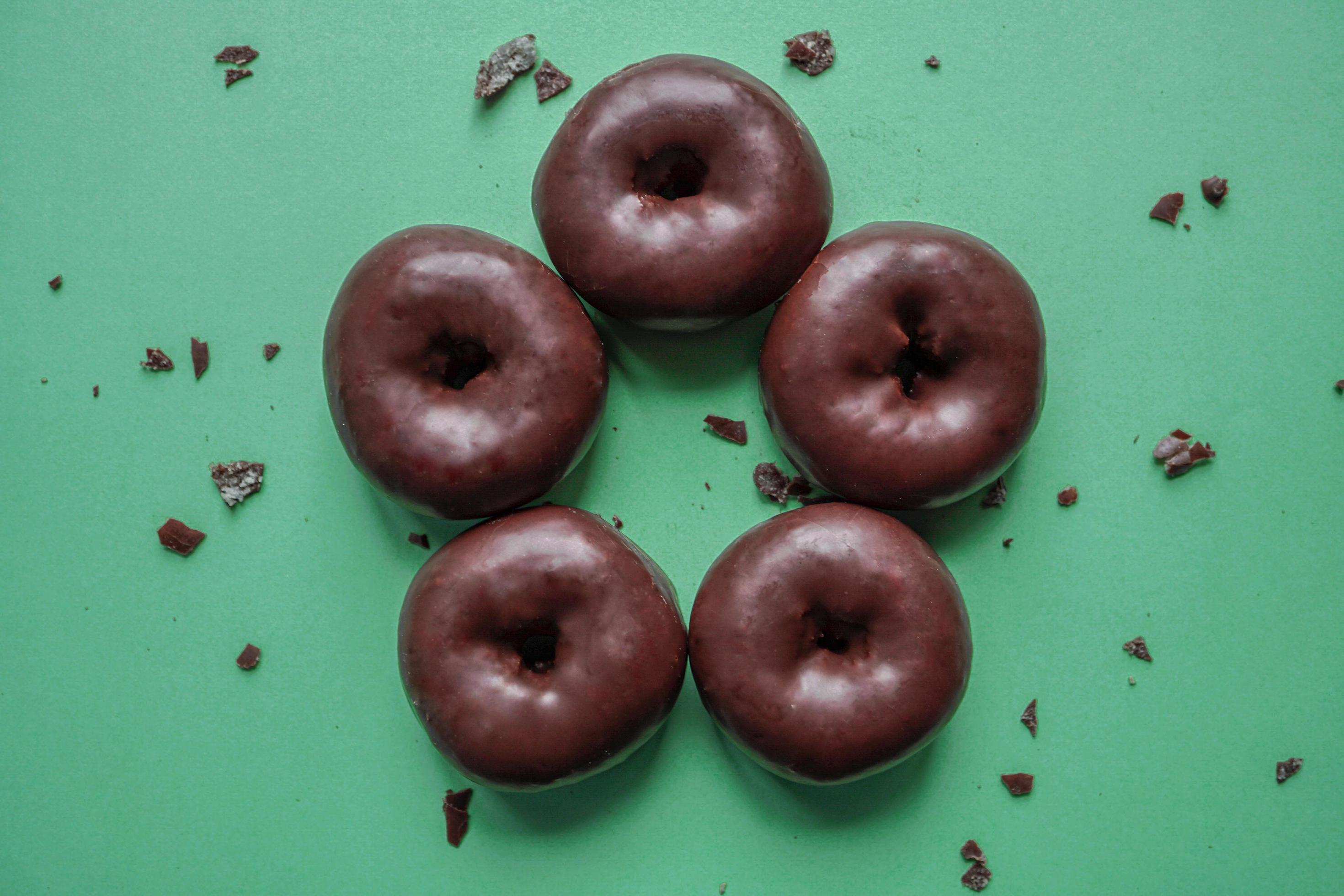 tasty chocolate donuts for breakfast, unhealthy food Stock Free