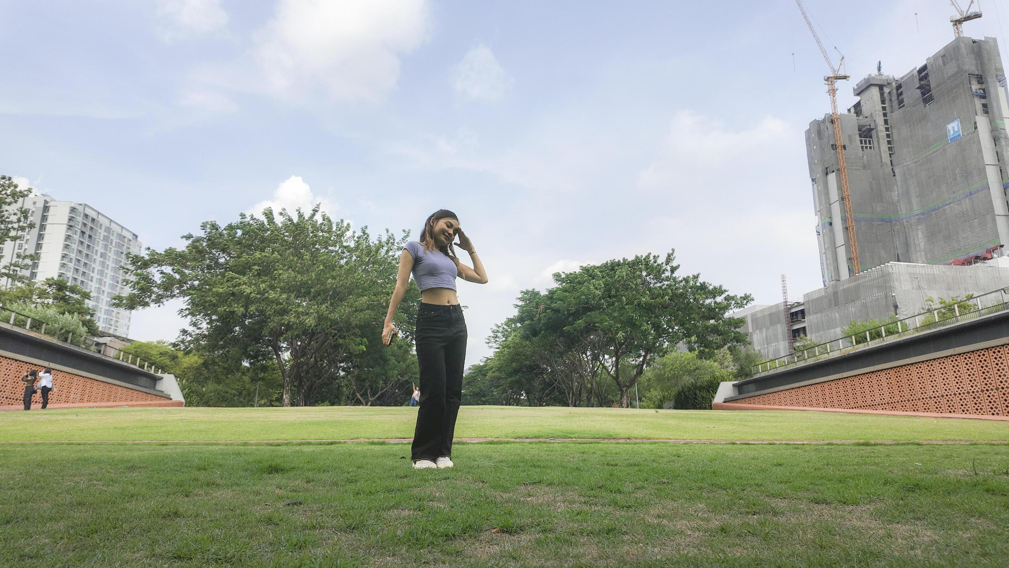 Asian women do freestyle hip hop and breakdancing in a public space in the middle of the city. With a cheerful and happy attitude Stock Free