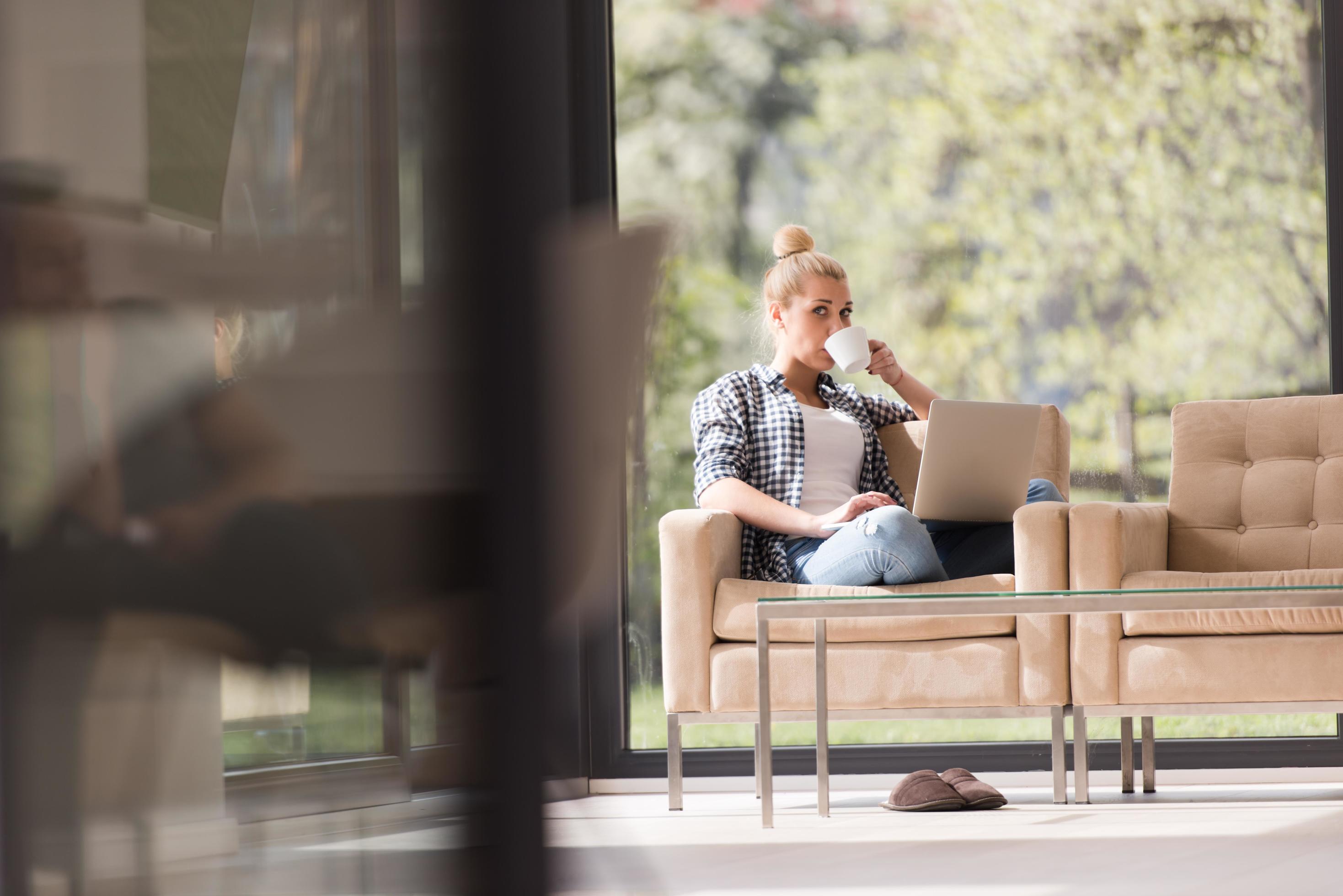 woman drinking coffee enjoying relaxing lifestyle Stock Free