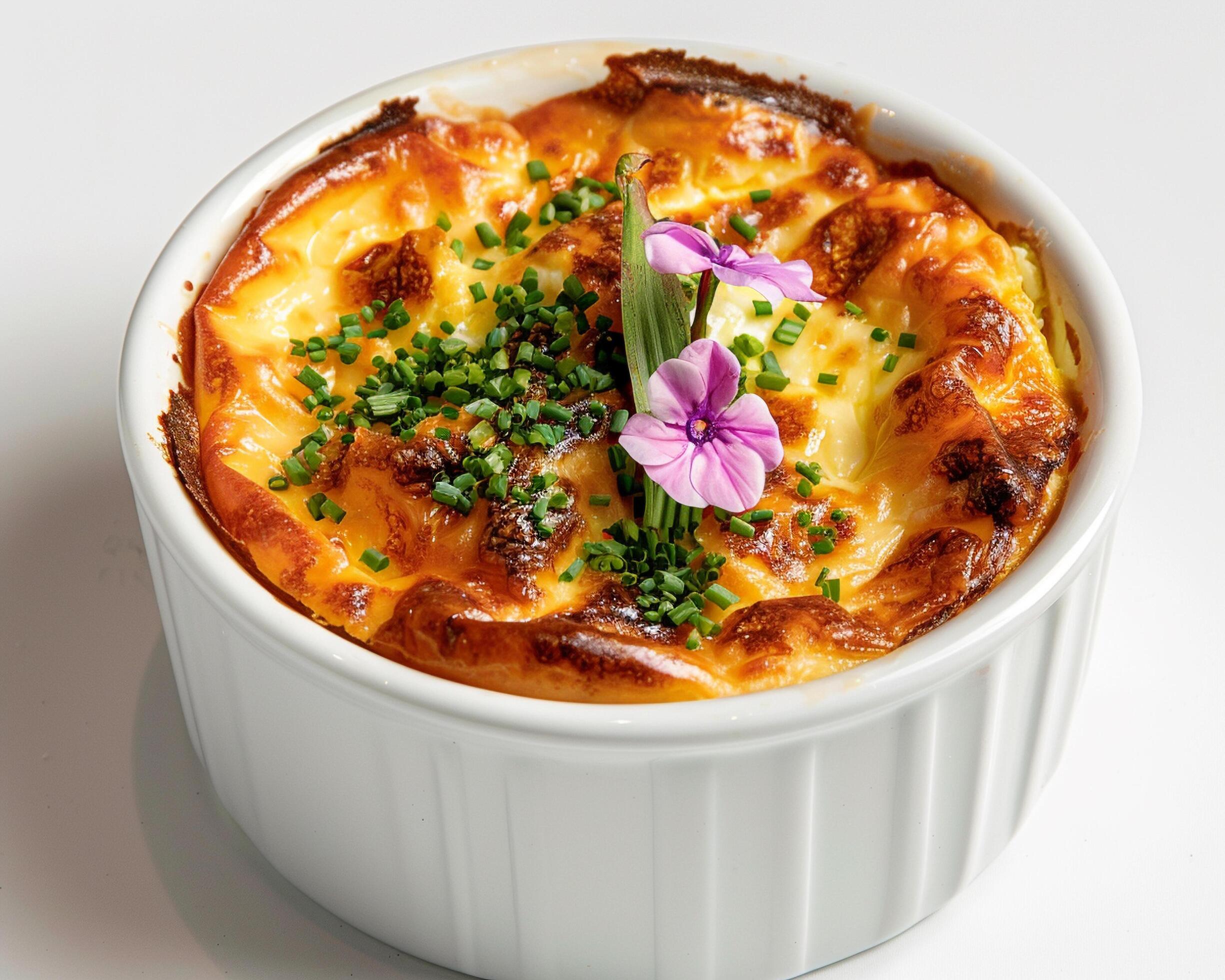 a white bowl with a dish of food in it Stock Free