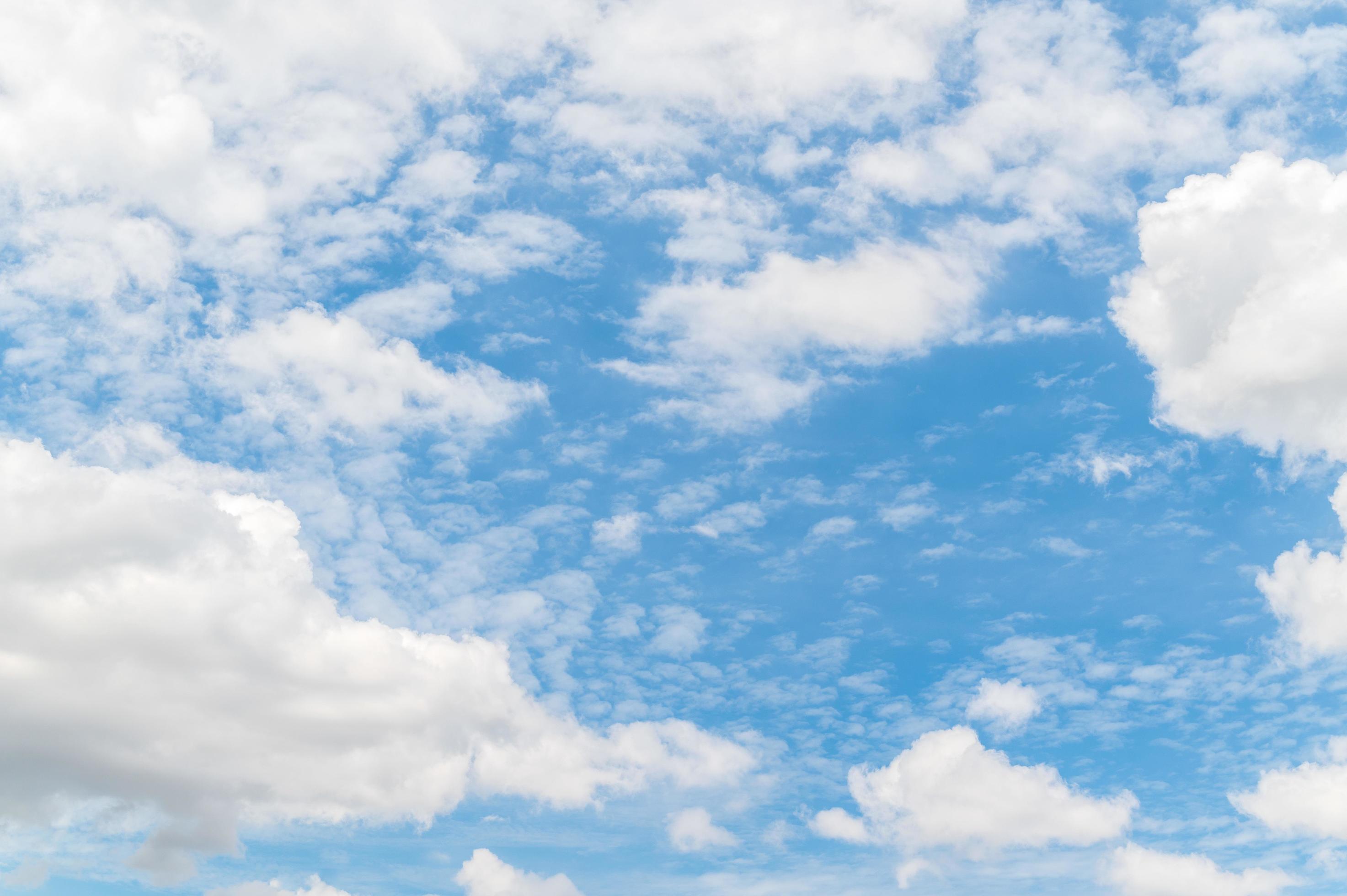 Beautiful white fluffy clouds in blue sky. Nature background from white clouds in sunny day Stock Free