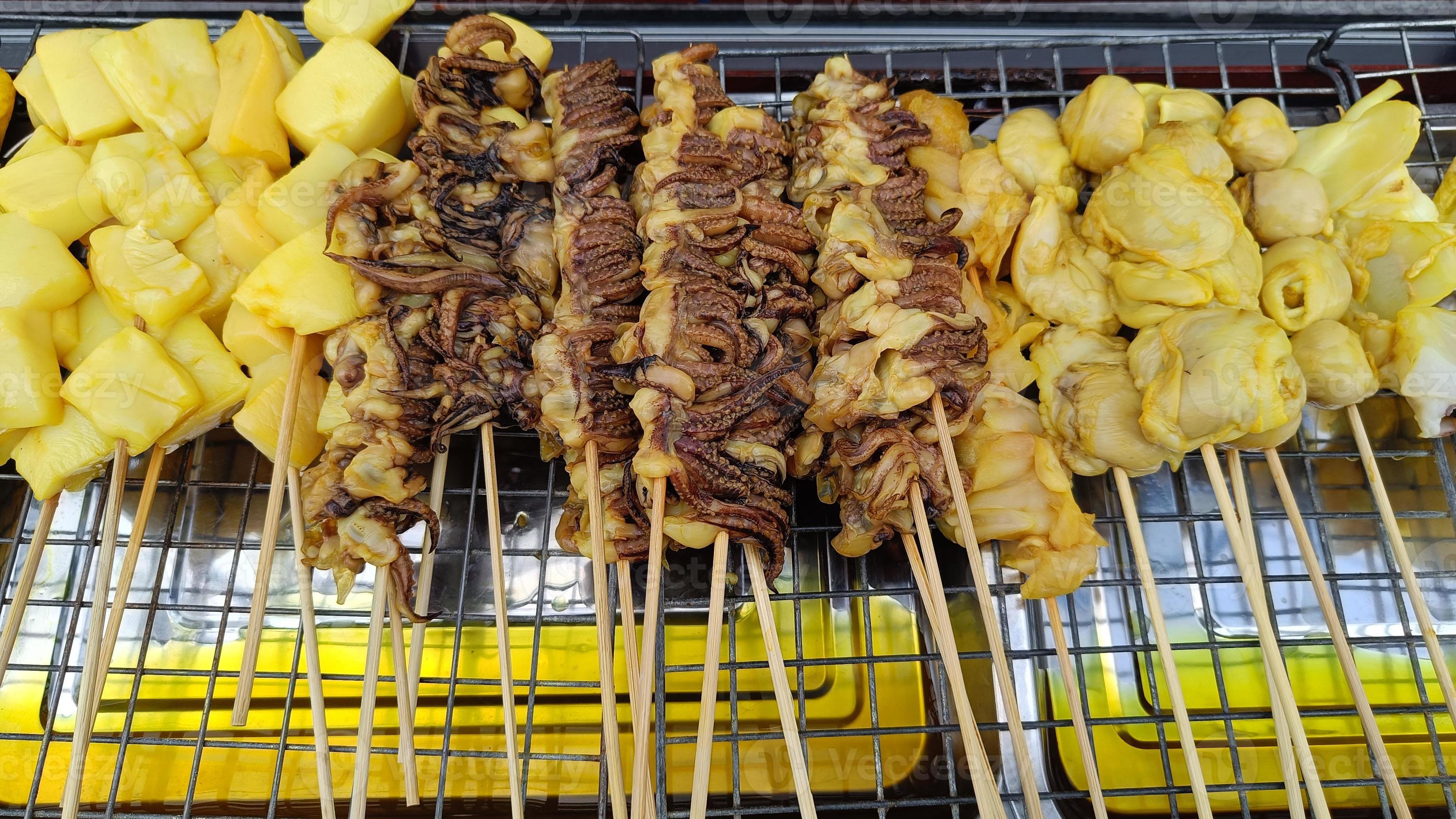 Squid skewers for grilling Thai street food delicious Stock Free