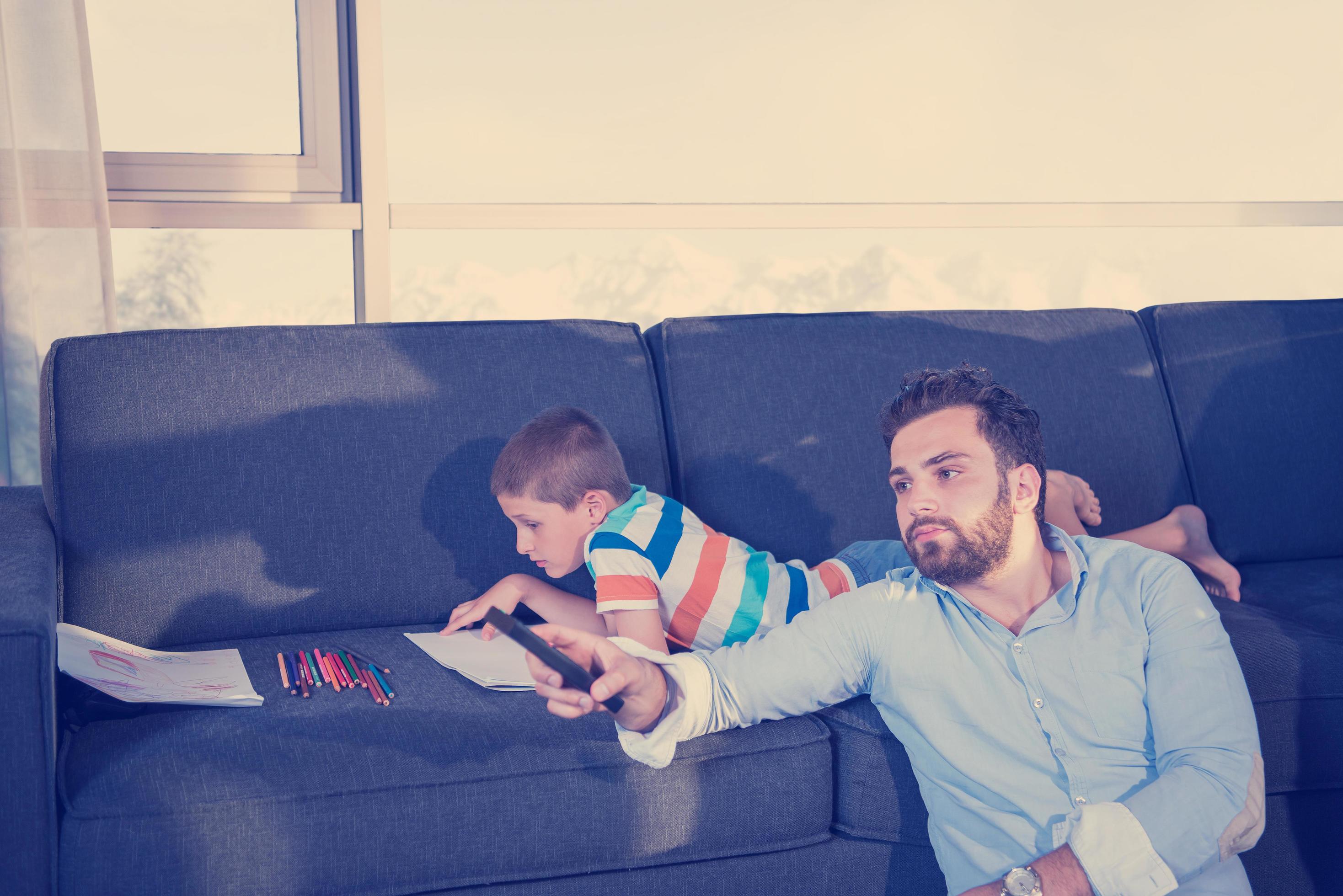 Happy Young Family Playing Together on sofa Stock Free