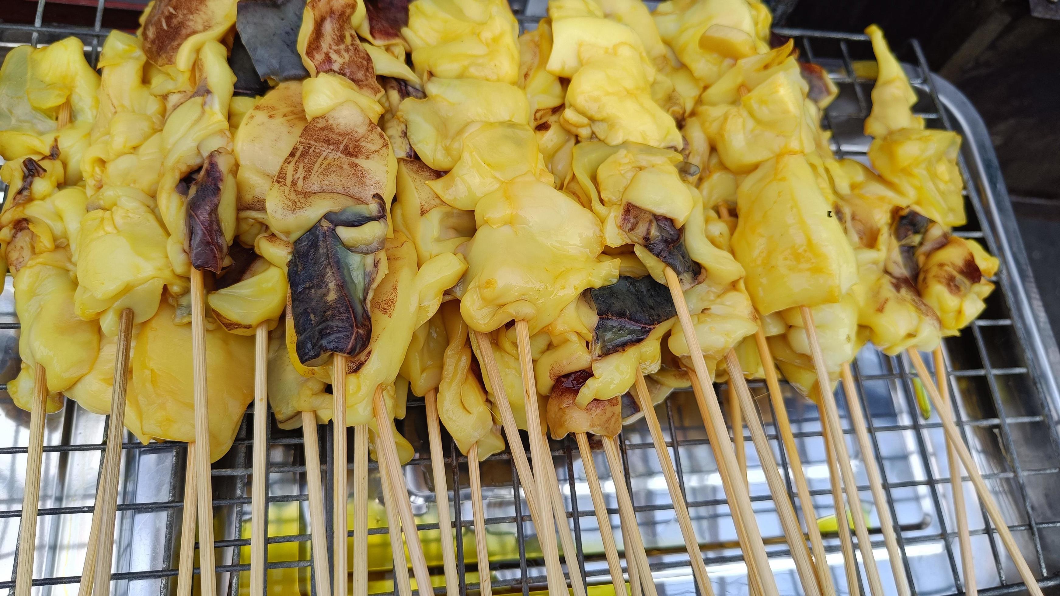 Delicious Squid skewers for grilling Thai street food delicious Stock Free