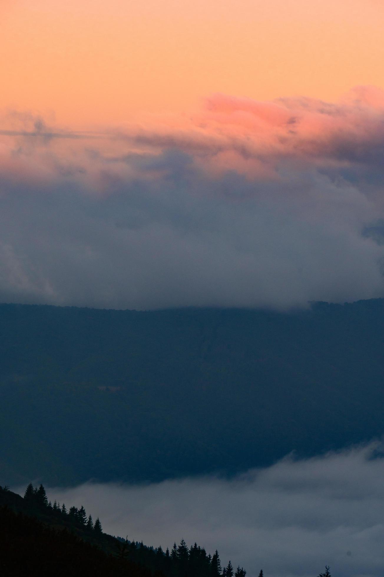 Dawn in the mountains, clouds covered the slopes of the Carpathians. Stock Free