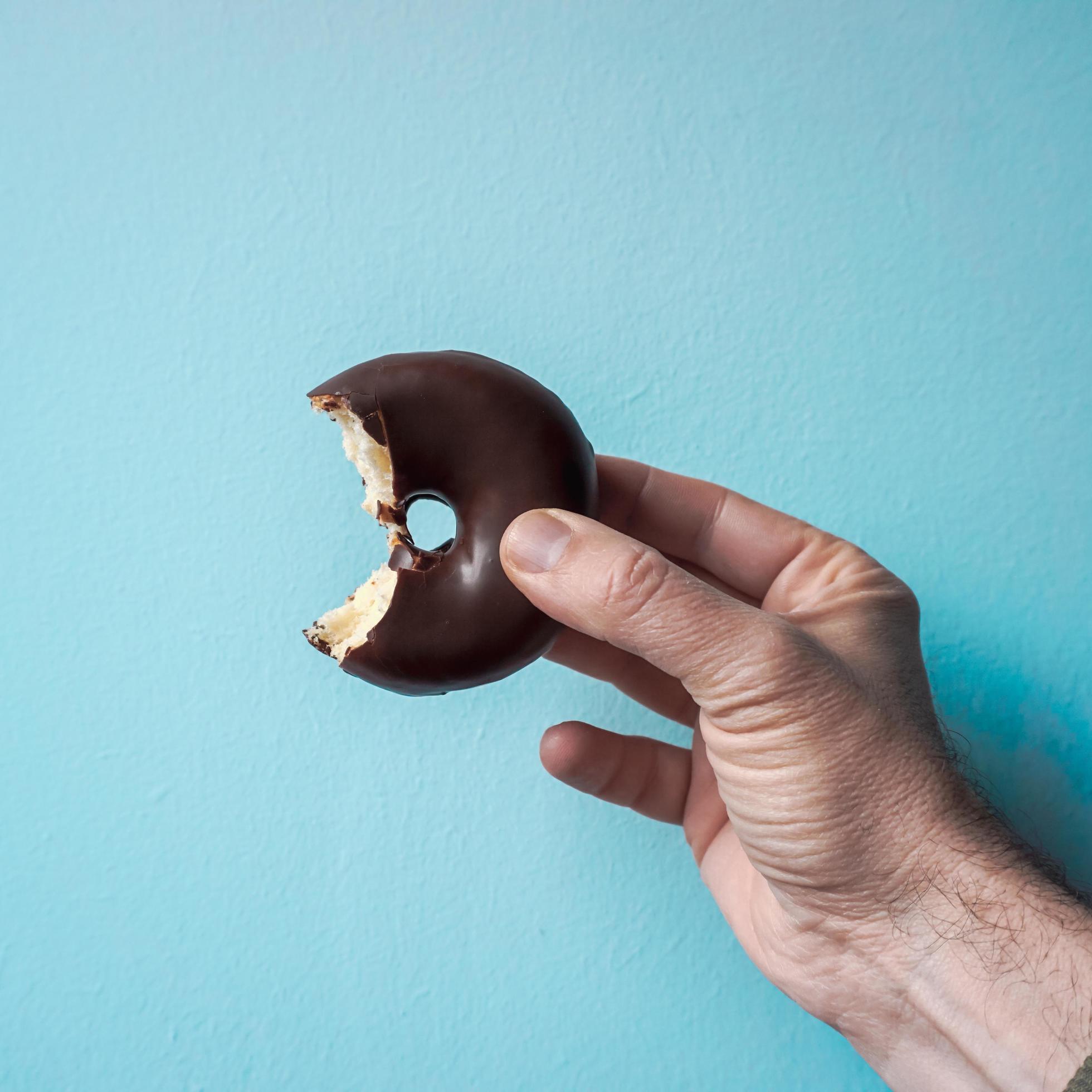 tasty chocolate donut for breakfast, unhealthy food Stock Free