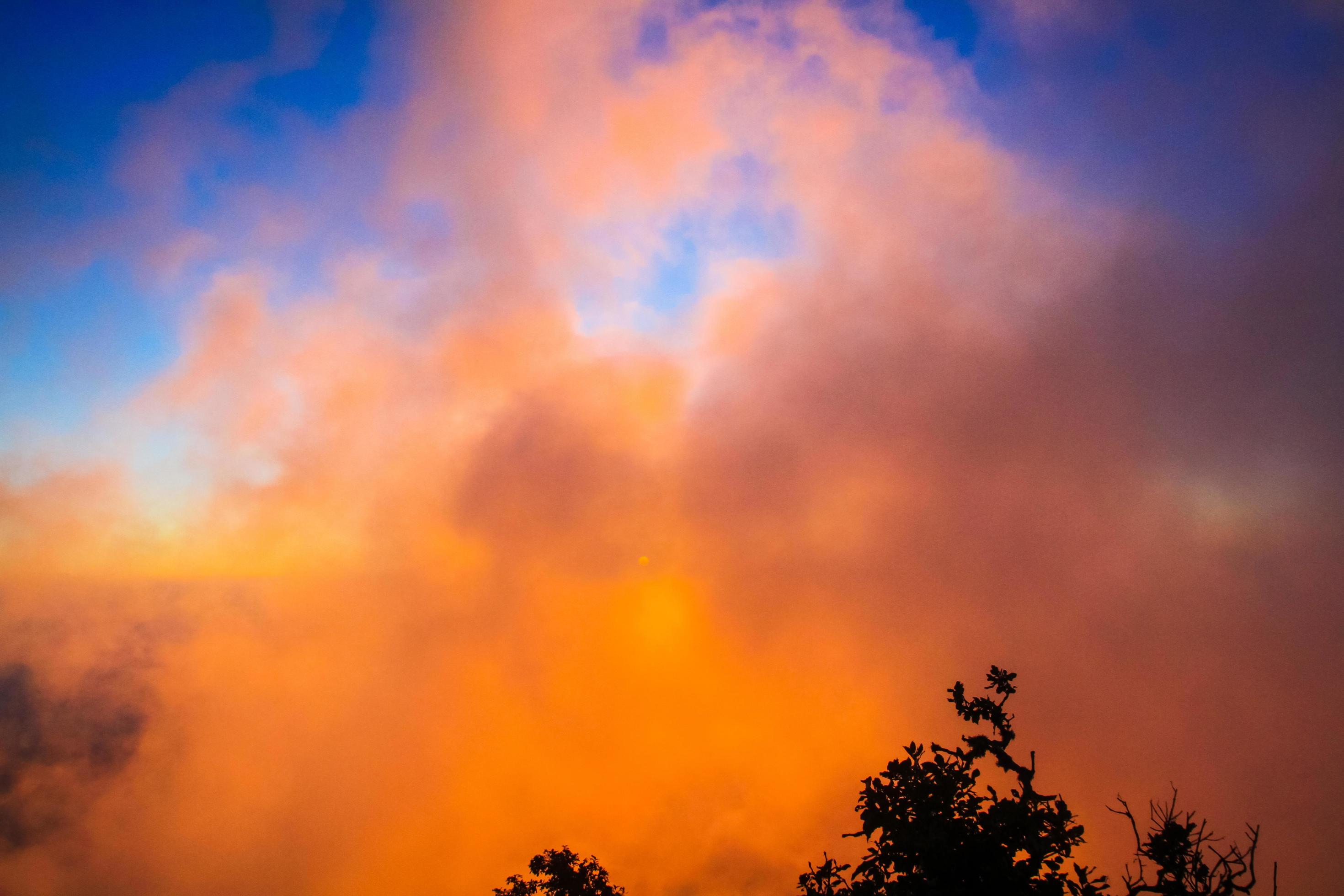 Sunset in sky and cloud, beautiful colorful twilight time with silhouette of mountain. Stock Free