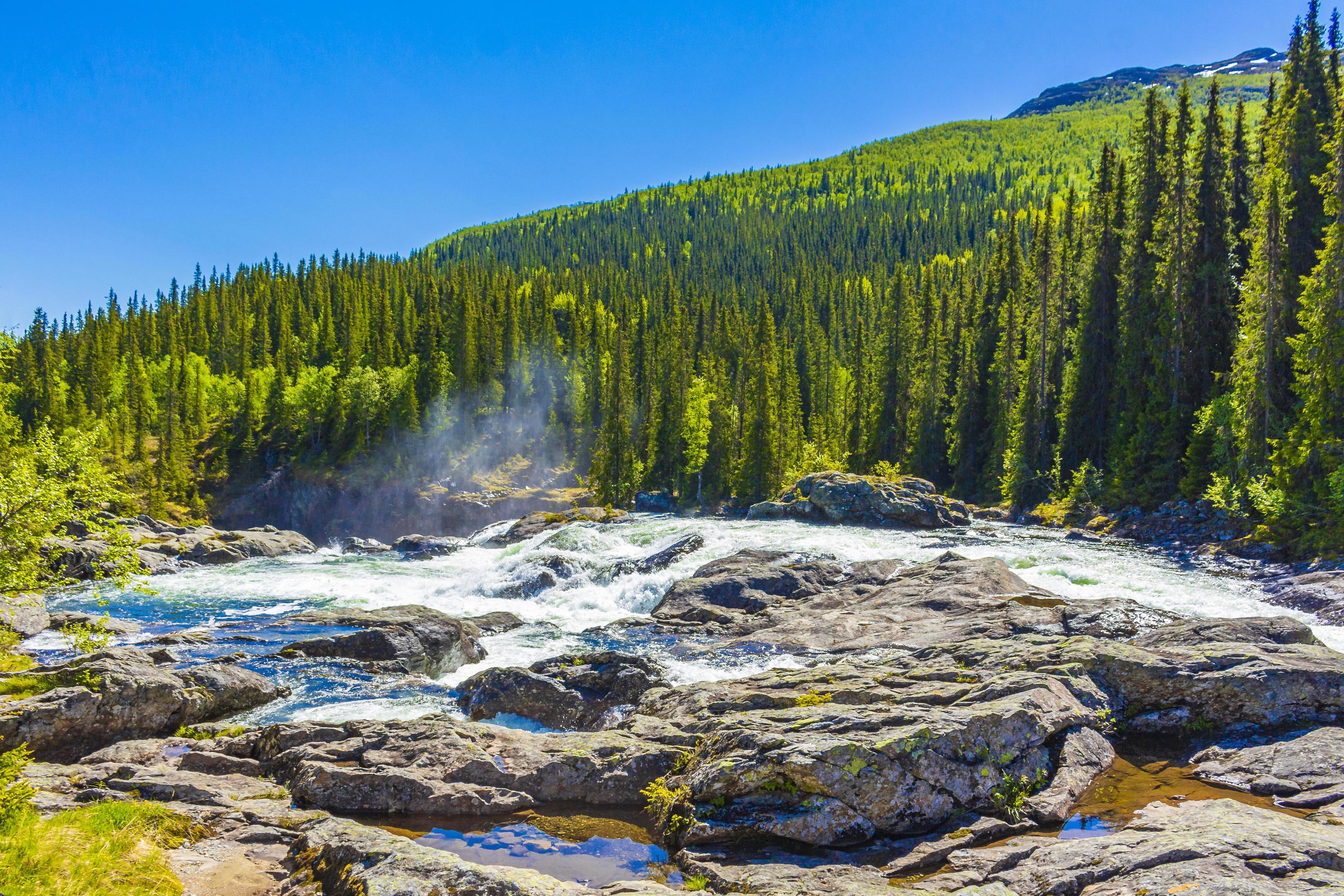 Fast flowing river water of beautiful waterfall Rjukandefossen Hemsedal Norway. Stock Free