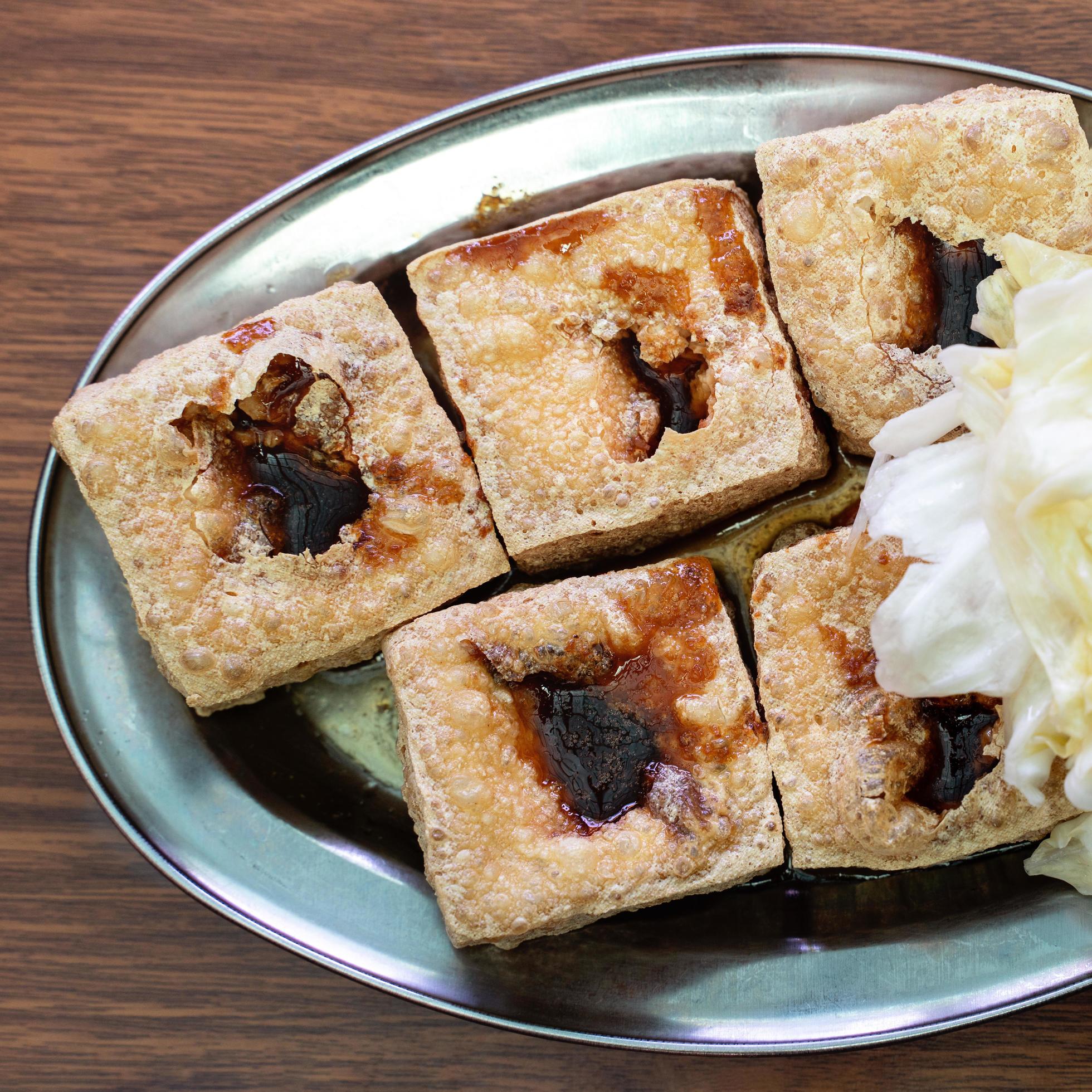 Deep fried stinky tofu with pickled cabbage, famous and delicious street food in Taiwan. Stock Free