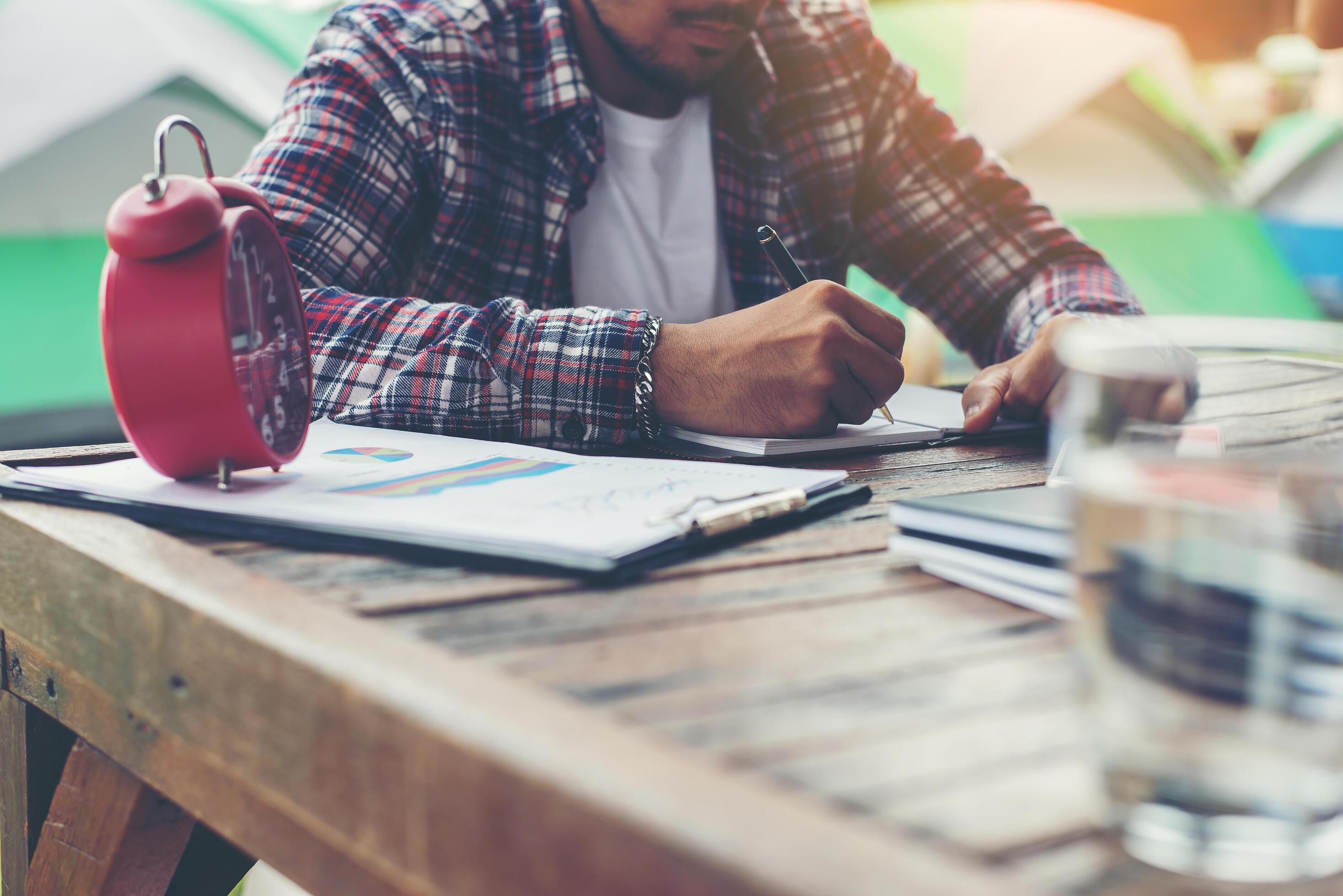 Hipster Businessman Working writing Determine Workspace Lifestyle Concept. Stock Free