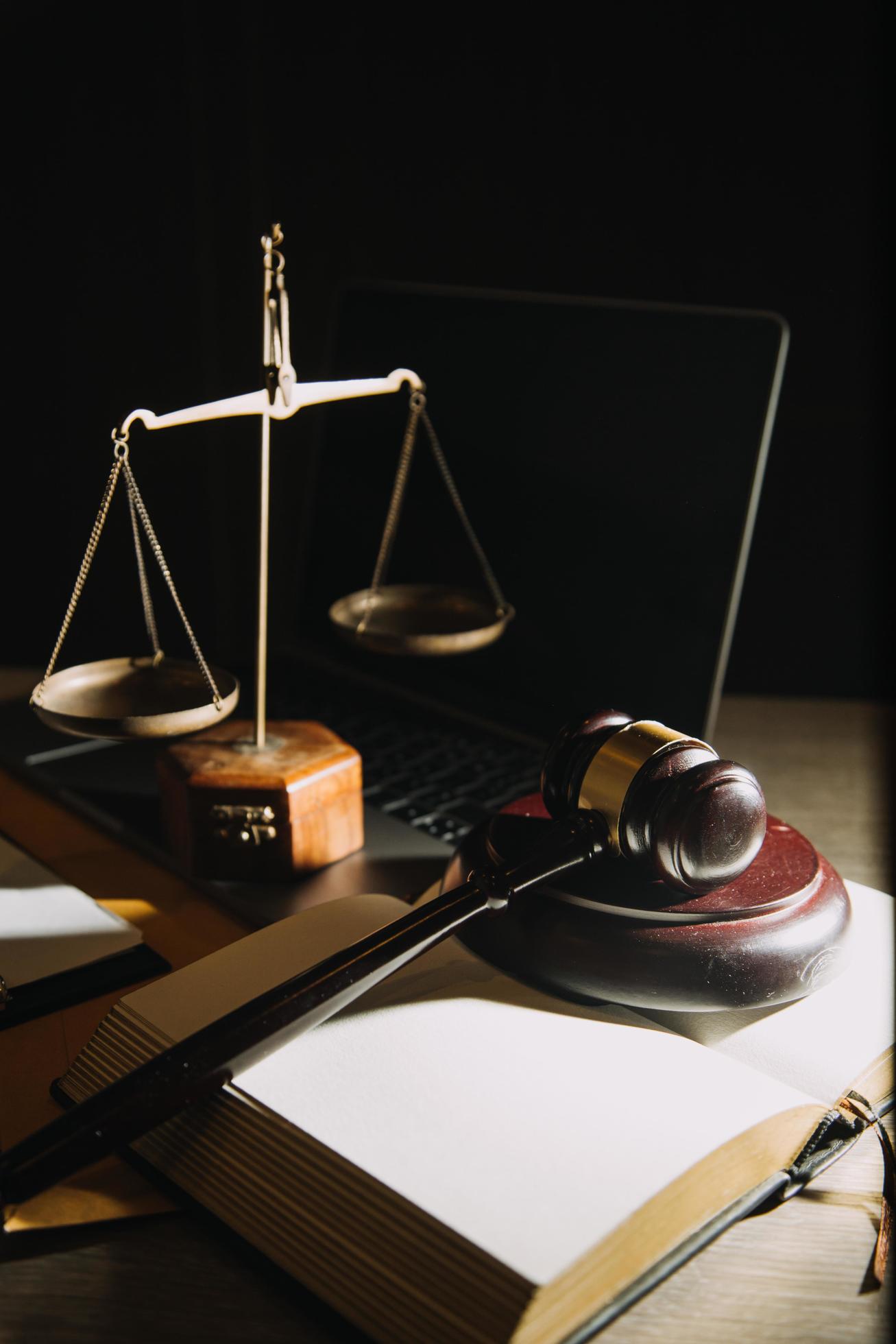 Business and lawyers discussing contract papers with brass scale on desk in office. Law, legal services, advice, justice and law concept Stock Free