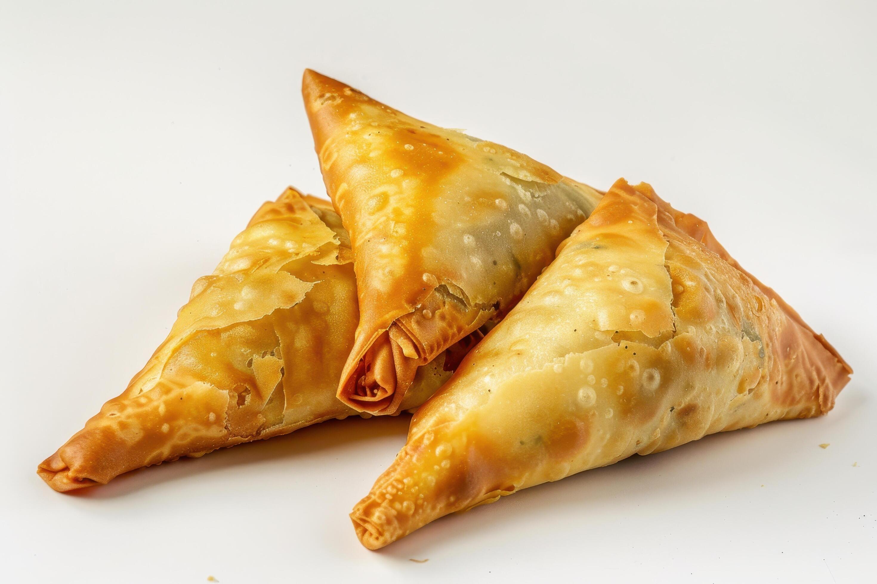 Three Golden Brown Fried Pastries on a White Background Stock Free