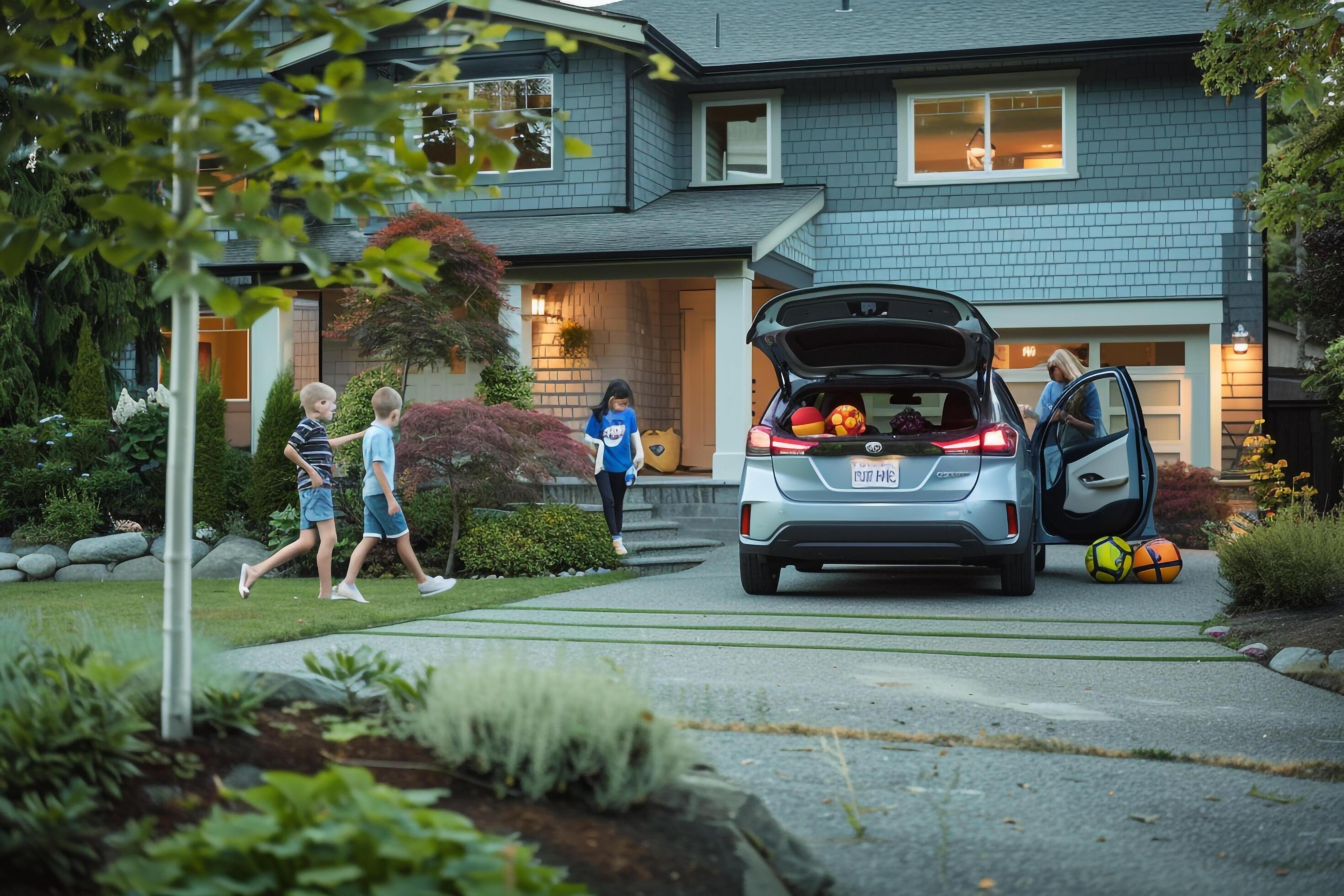 Hybrid Car in Suburban Driveway Family and Kids with nature background Stock Free