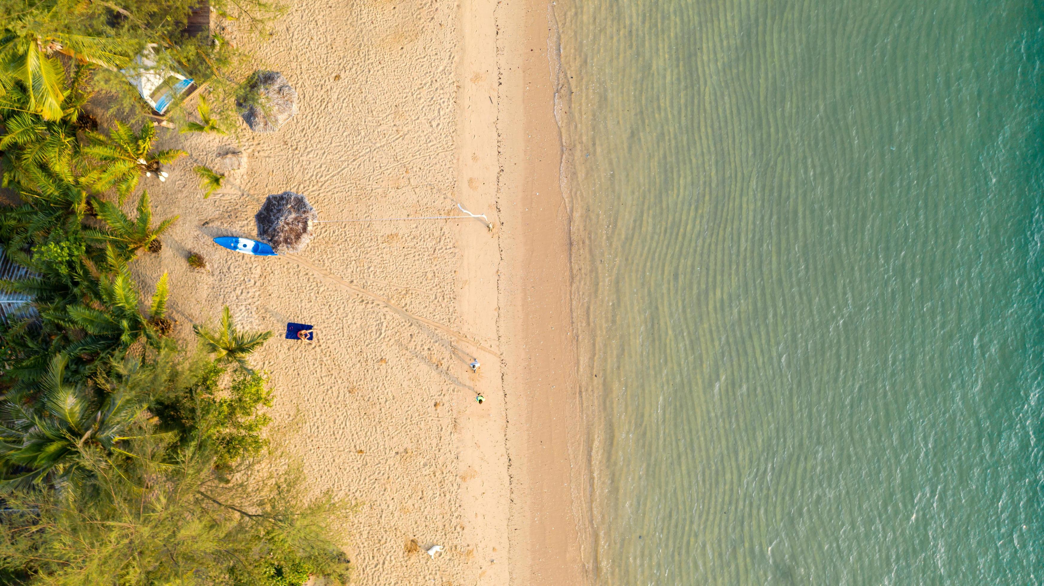 Aerial view Sea view Amazing thailand nature background Water and beautifully bright beach with kayak on ocean at sunny day Stock Free