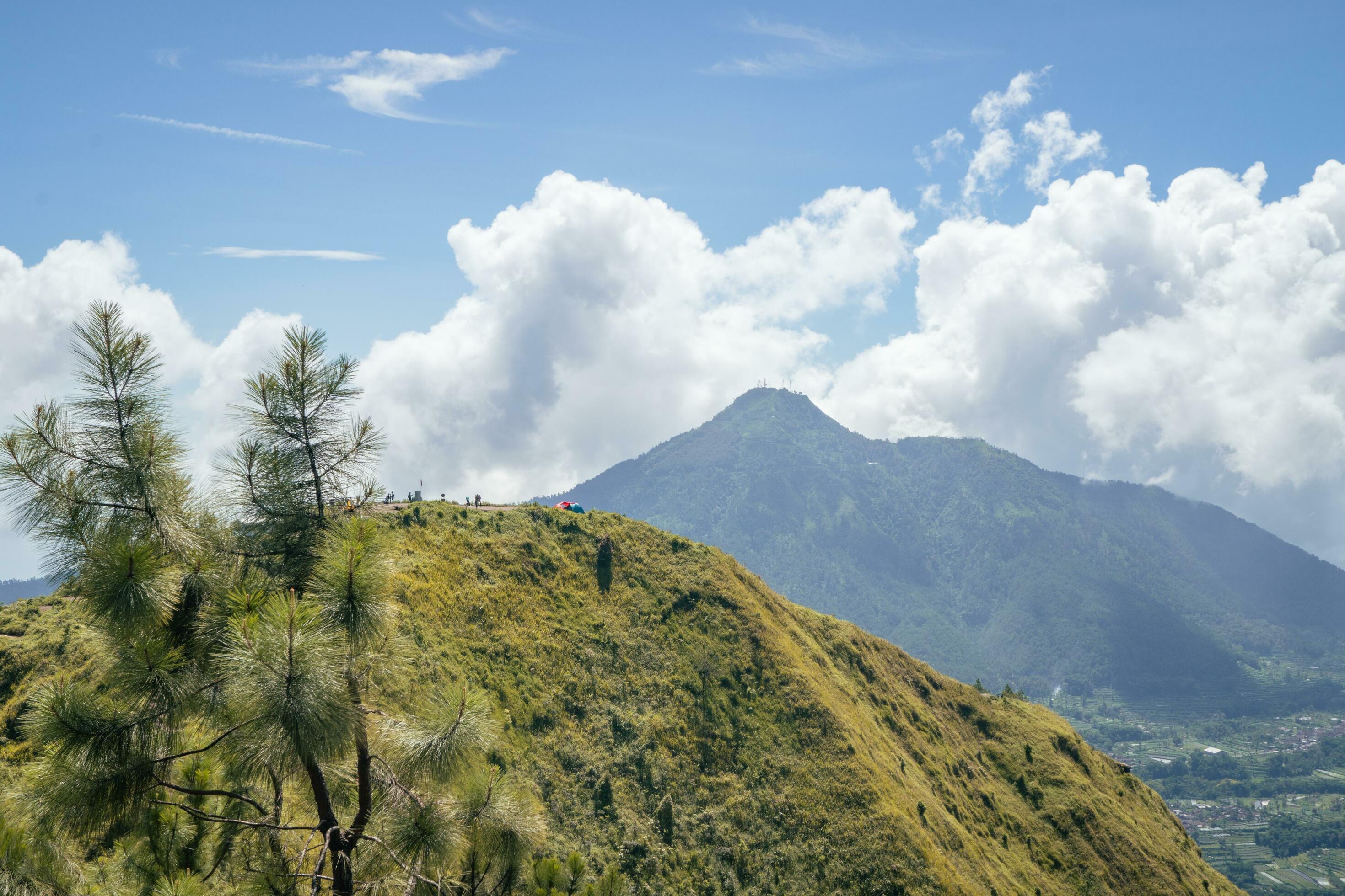 Landscape mountain when morning time sunlight summer vibes. The photo is suitable to use for adventure content media, nature poster and forest background. Stock Free