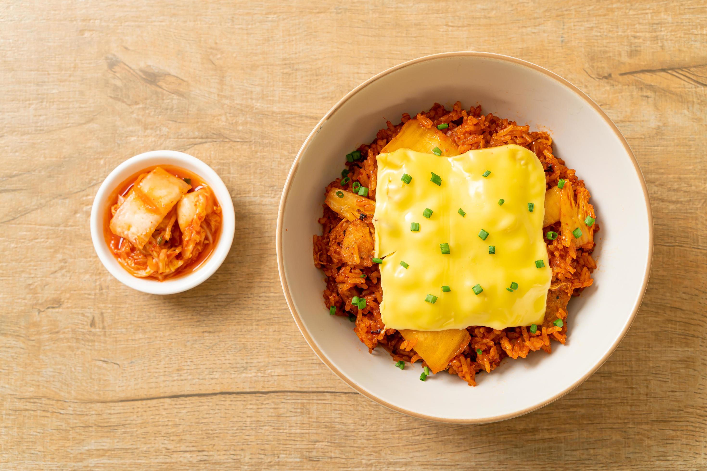 Kimchi fried rice with pork and topped cheese – Asian and fusion food style Stock Free