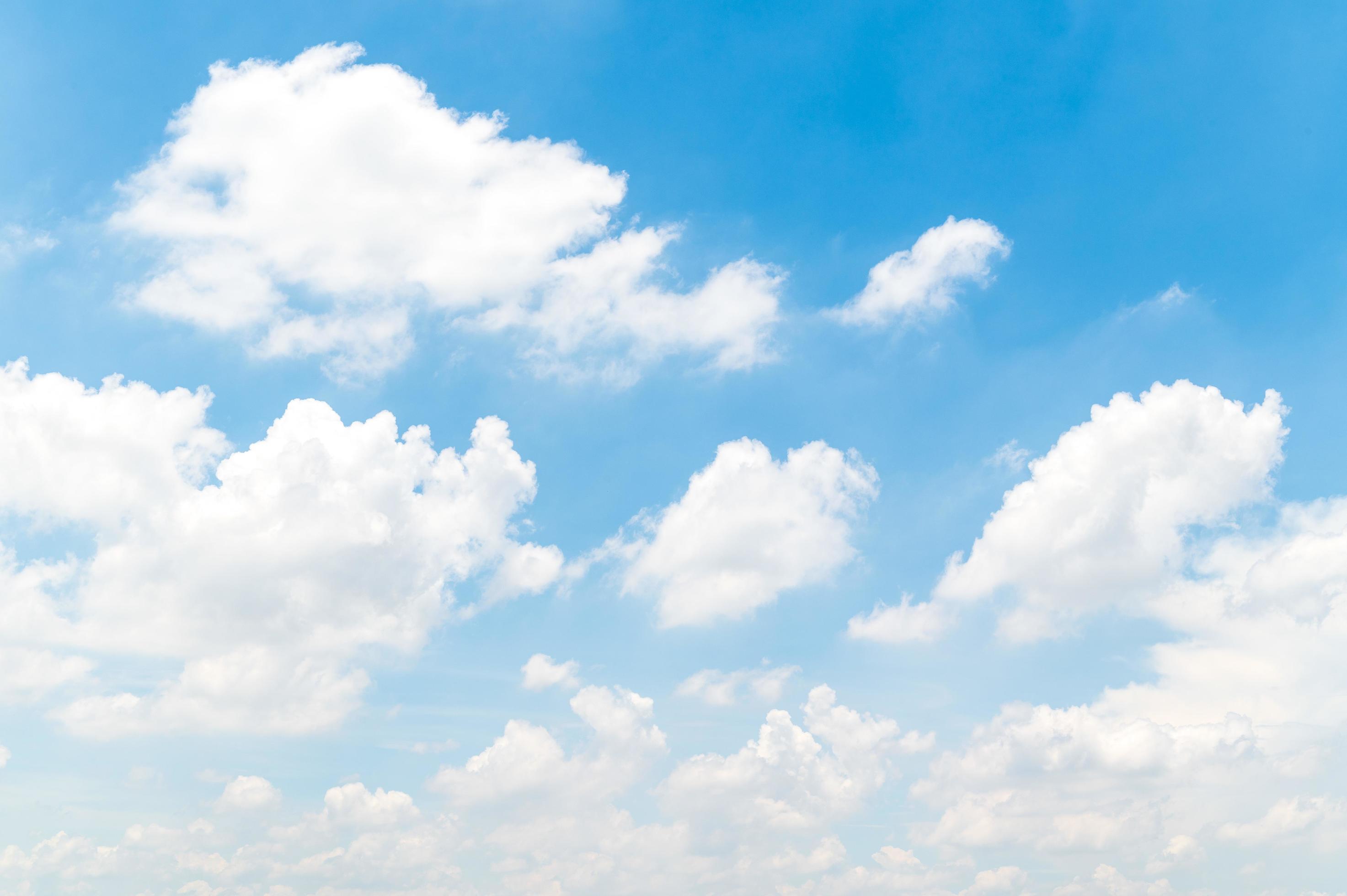 Beautiful white fluffy clouds in blue sky. Nature background from white clouds in sunny day Stock Free