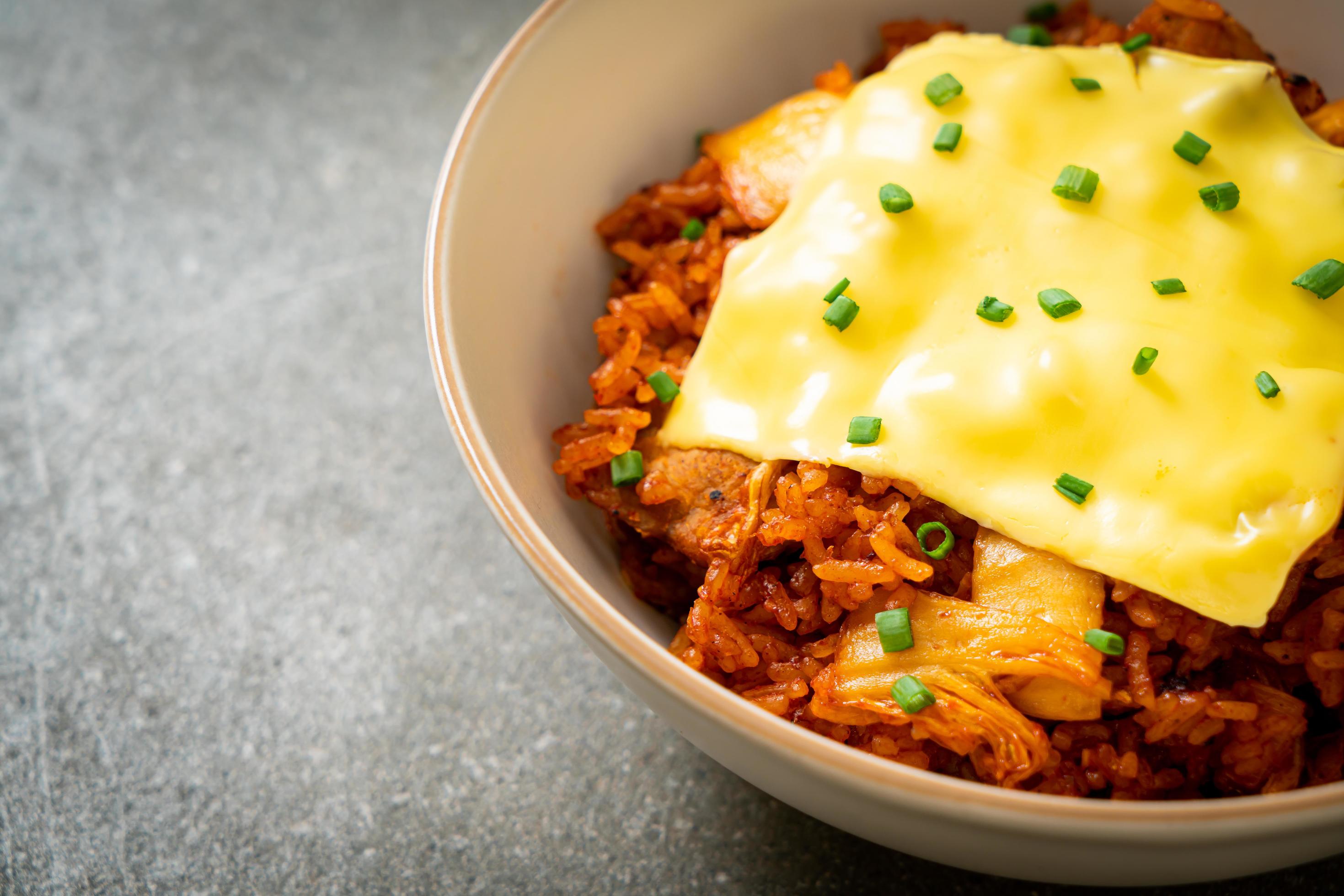 Kimchi fried rice with pork and topped cheese – Asian and fusion food style Stock Free