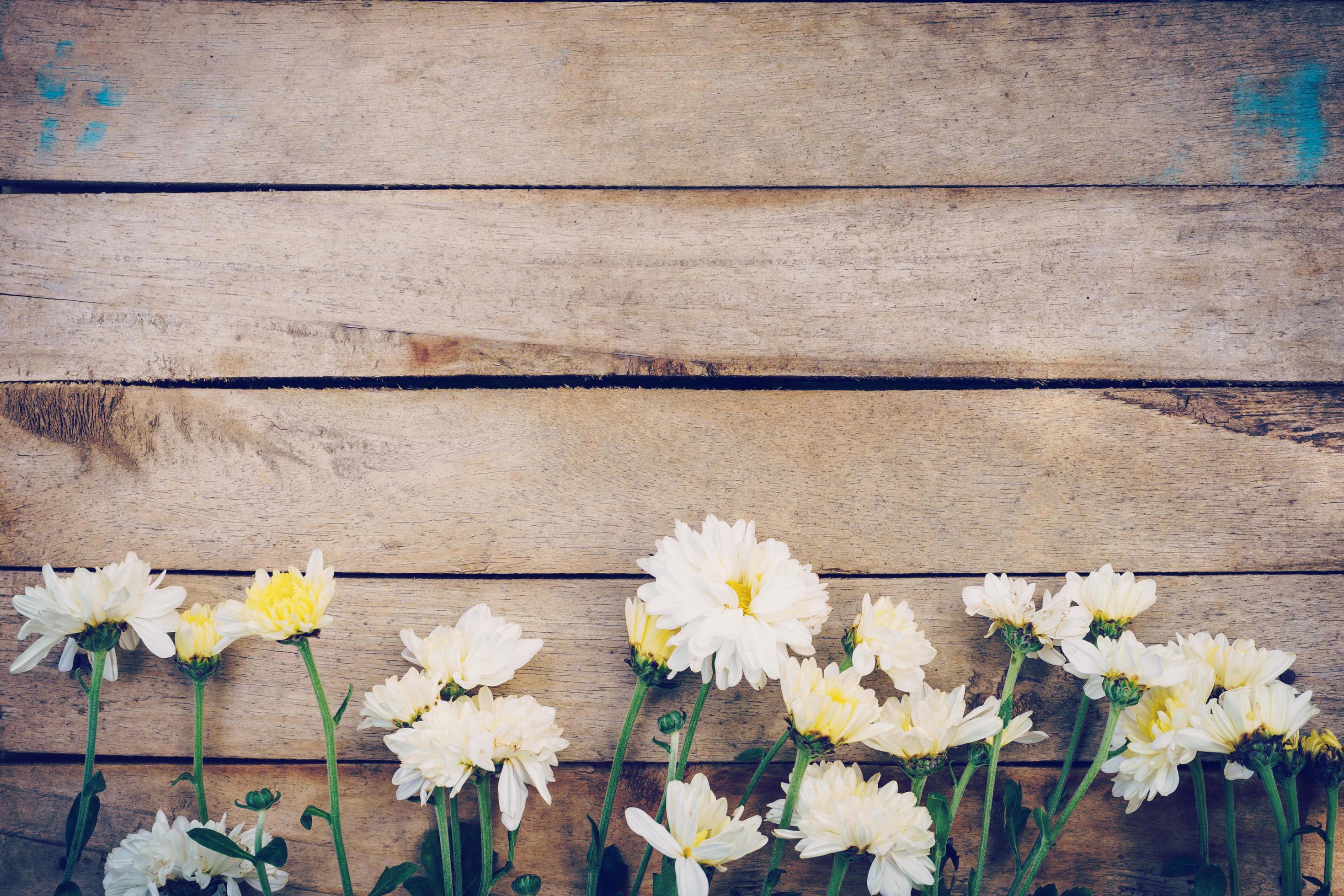 Flowers on old grunge wooden table texture and background with copy space. Stock Free