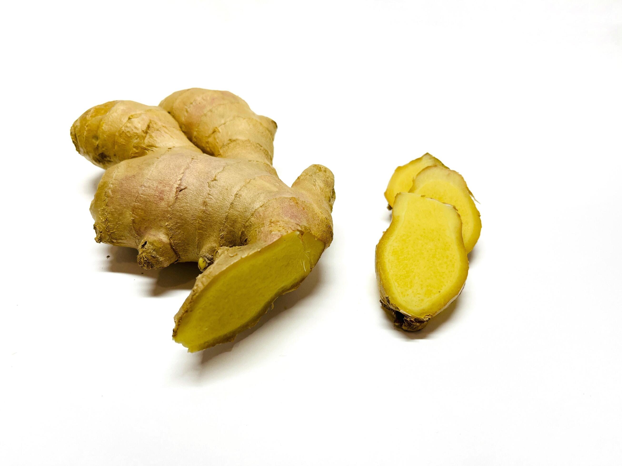 Ginger root with sliced on white background Stock Free