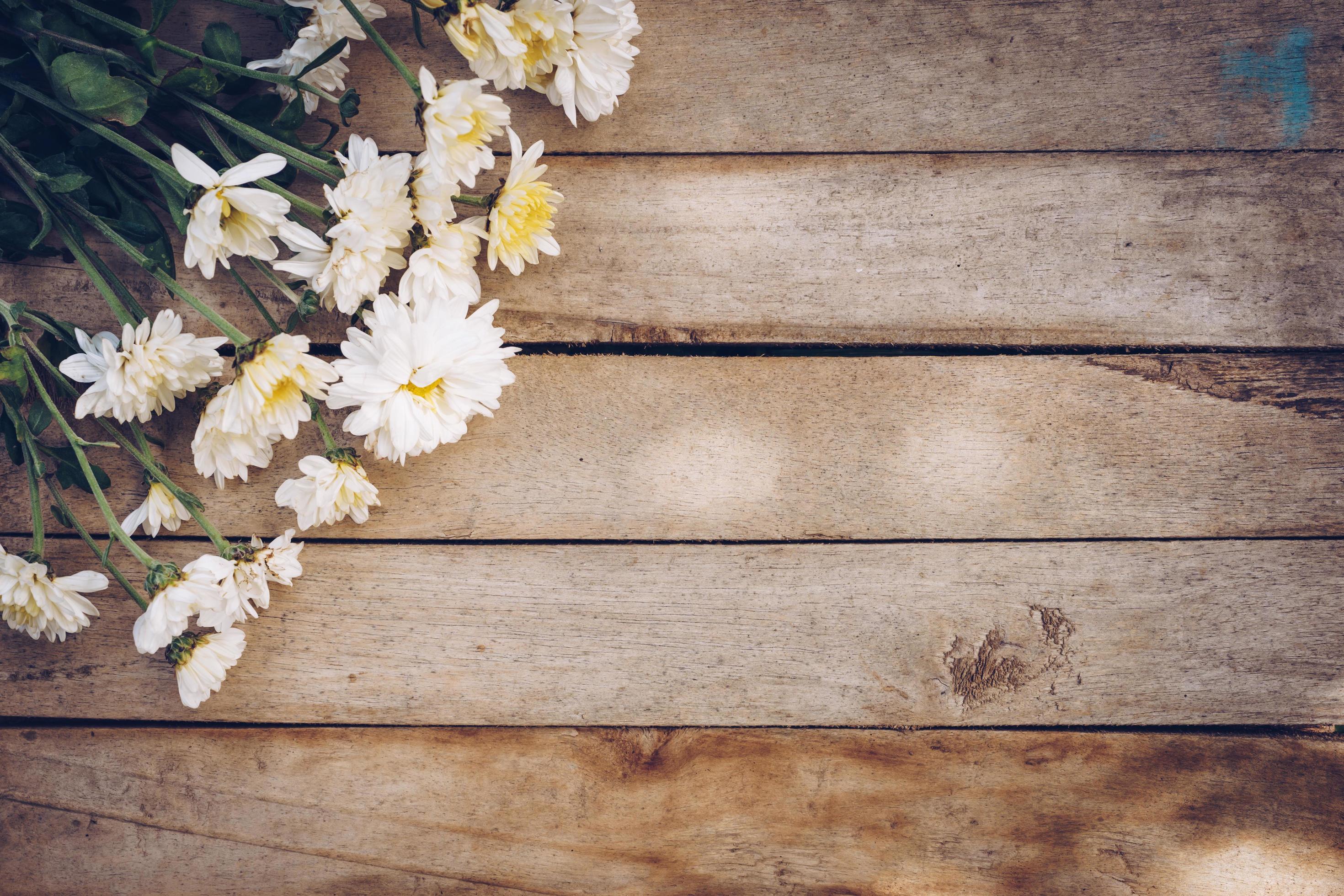 Flowers on old grunge wooden table texture and background with copy space. Stock Free