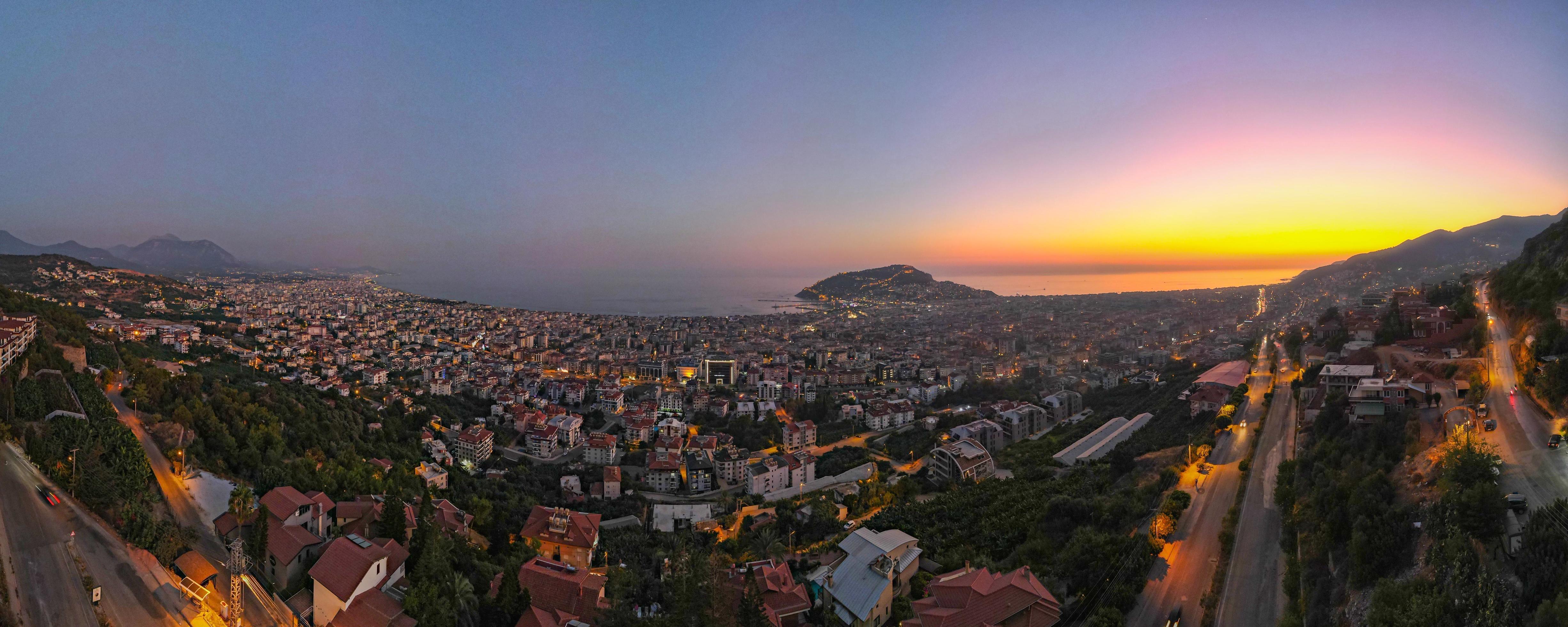 Alanya City, Antalya, 2022 Sea Bay panorama aerial bird view from above, beautiful sunset over resort city at mediterranean sea, drone point of view Stock Free