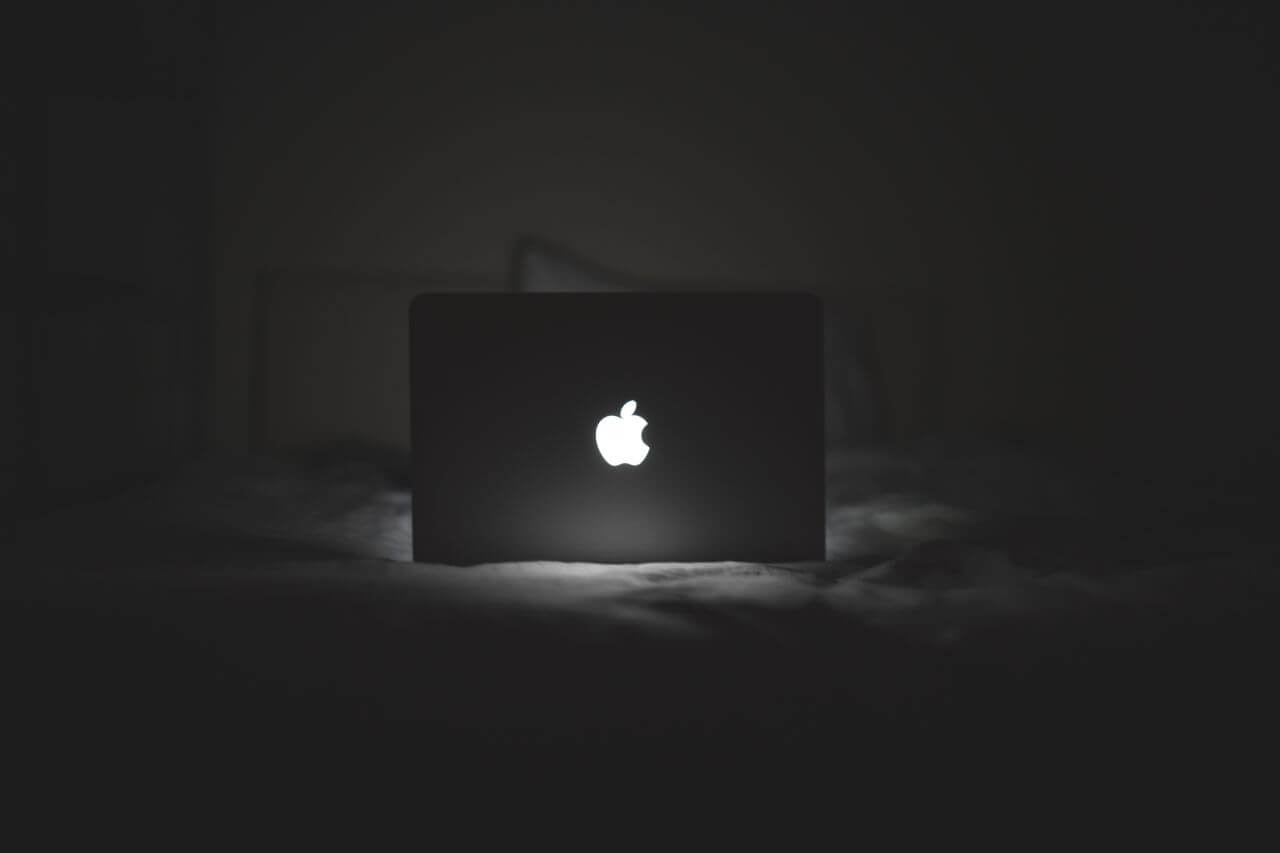 
									B&W MacBook Glowing Apple Logo Stock Free