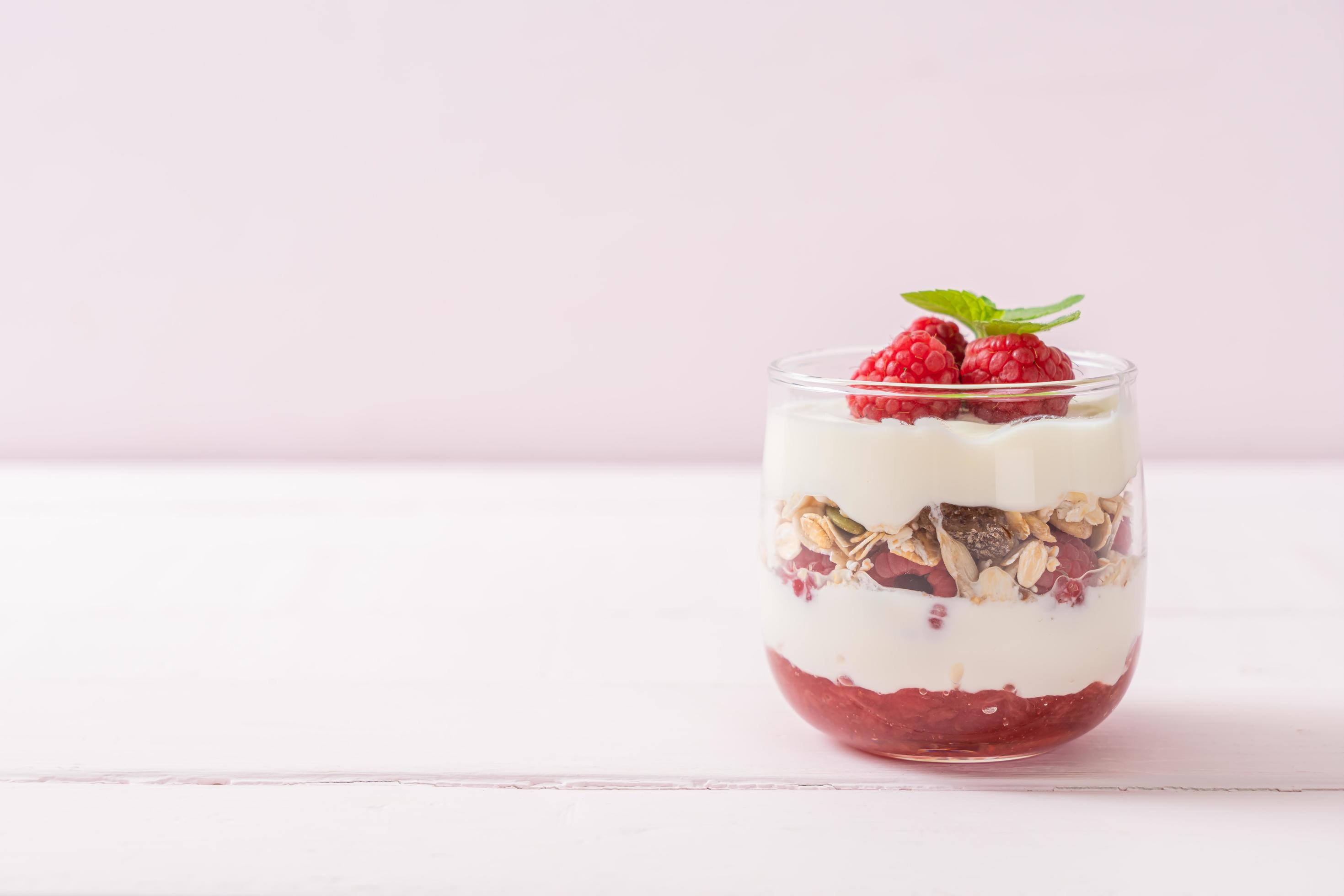 Fresh raspberry and yogurt with granola – Healthy food style Stock Free