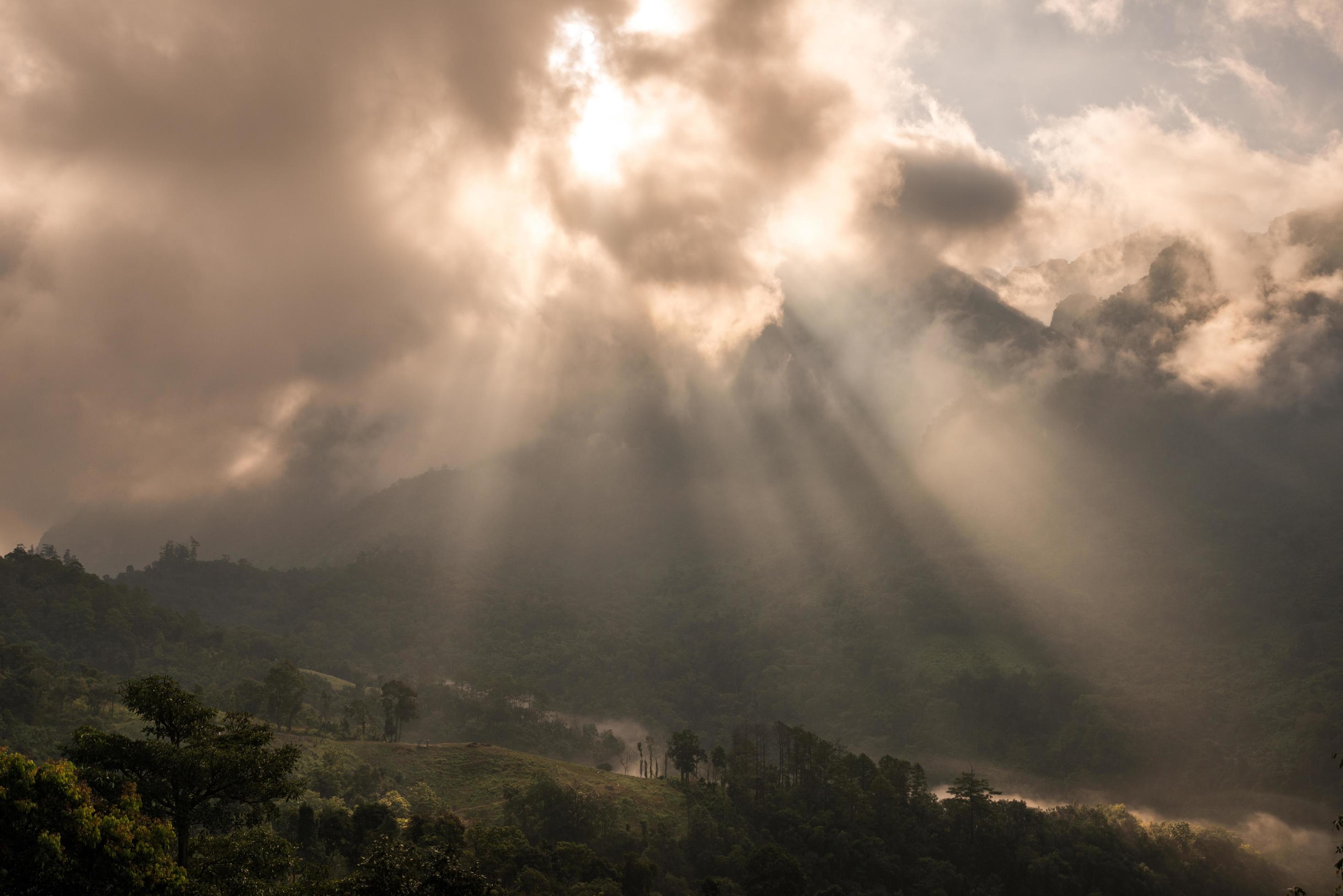 The sunbeam shining to the land in the countryside of Chiang Dao mountain in Chiang Mai province of Thailand. Stock Free