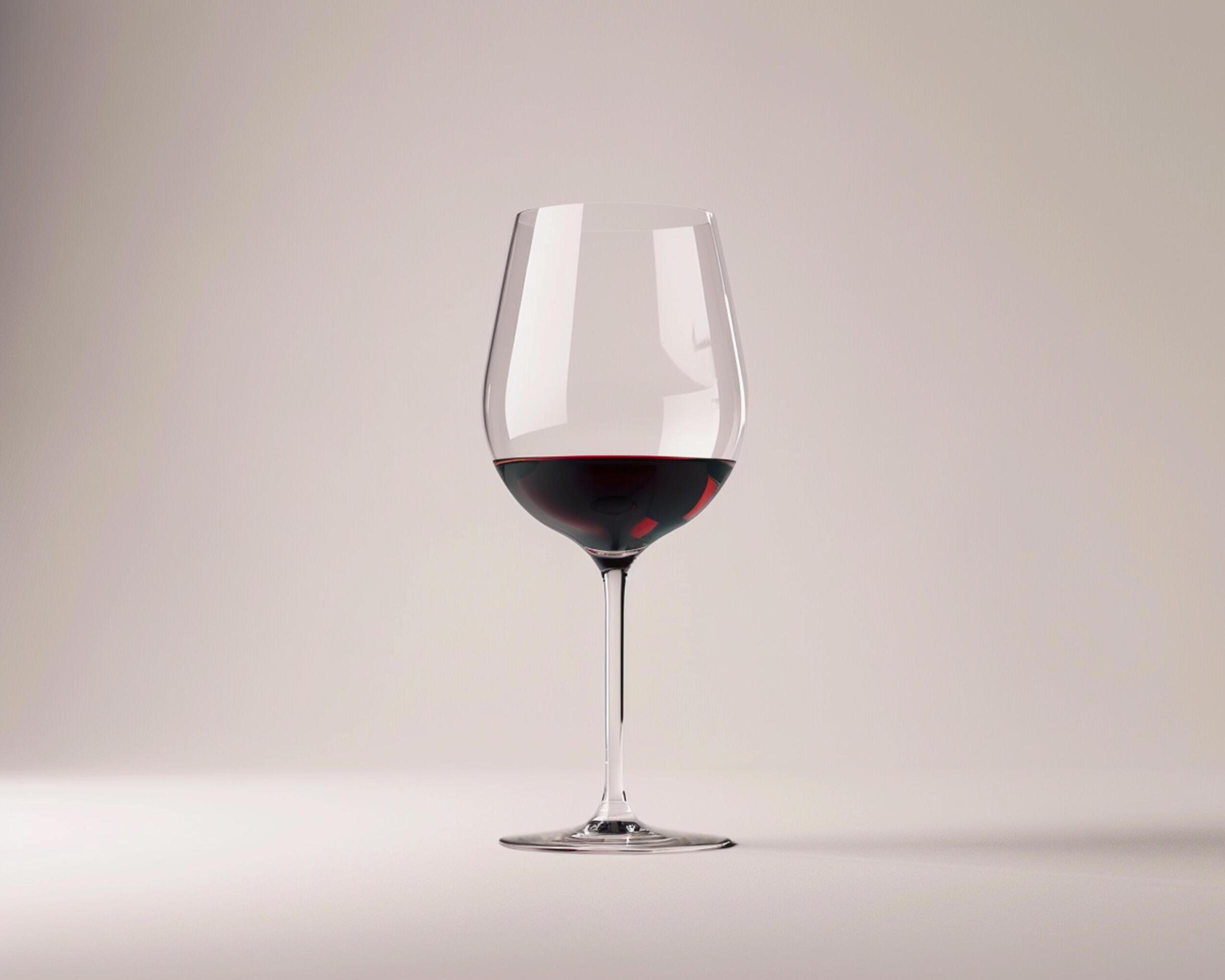 a wine glass with red wine in it Stock Free