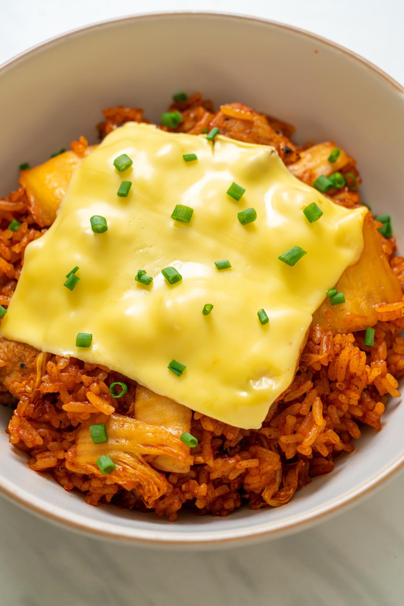 Kimchi fried rice with pork and topped cheese – Asian and fusion food style Stock Free