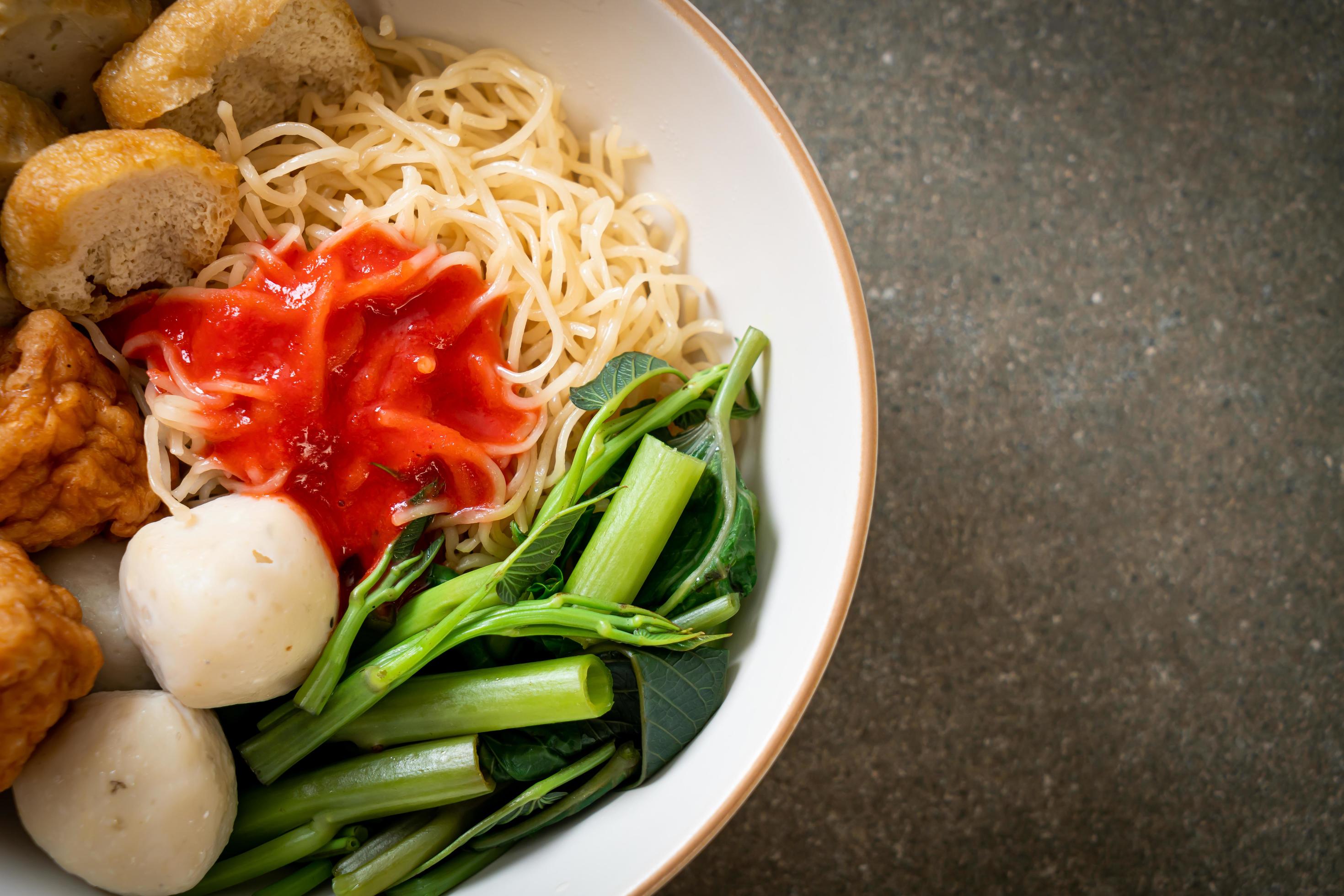 Egg noodles with fish balls and shrimp balls in pink sauce, Yen Ta Four or Yen Ta Fo – Asian food style Stock Free