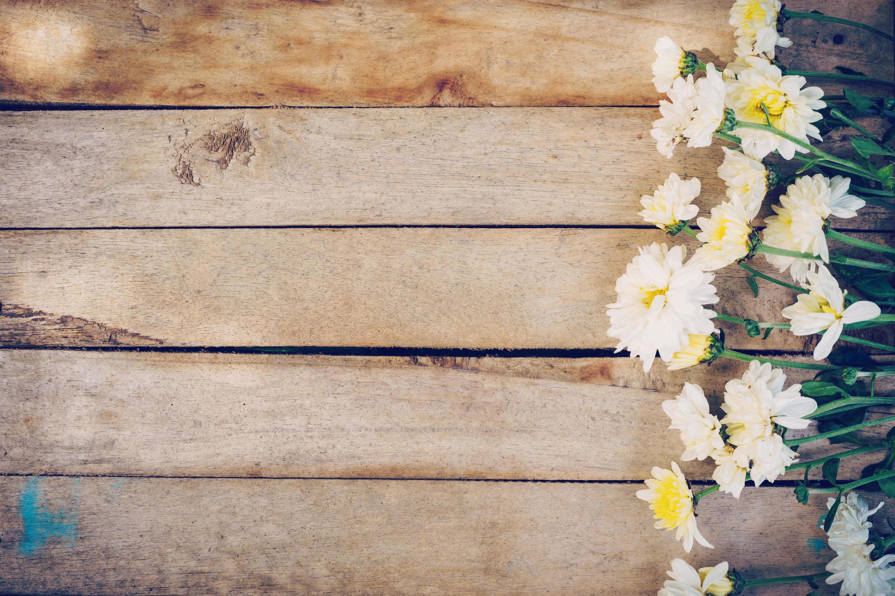 Flowers on old grunge wooden table texture and background with copy space. Stock Free