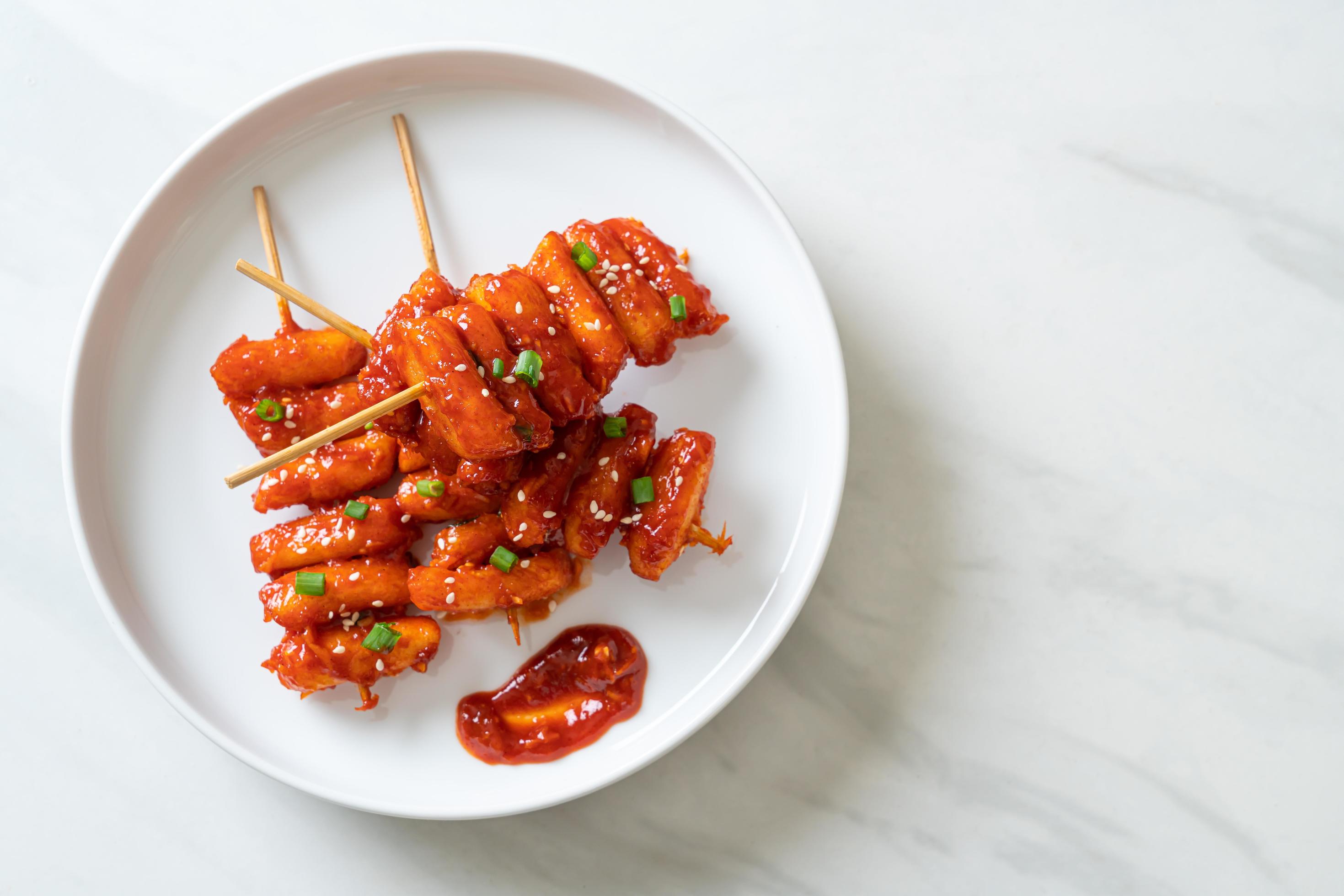 Deep-fried Korean rice cake, or Tteokbokki, with spicy sauce – Korean food style Stock Free