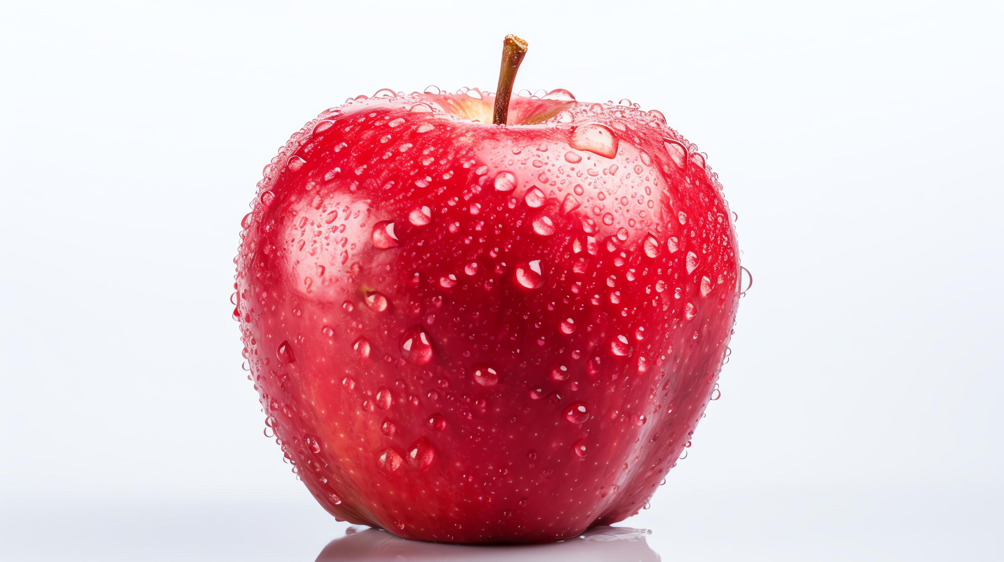 Single apple with water droplets, isolated on a white background, detailed texture visible, soft light. Stock Free