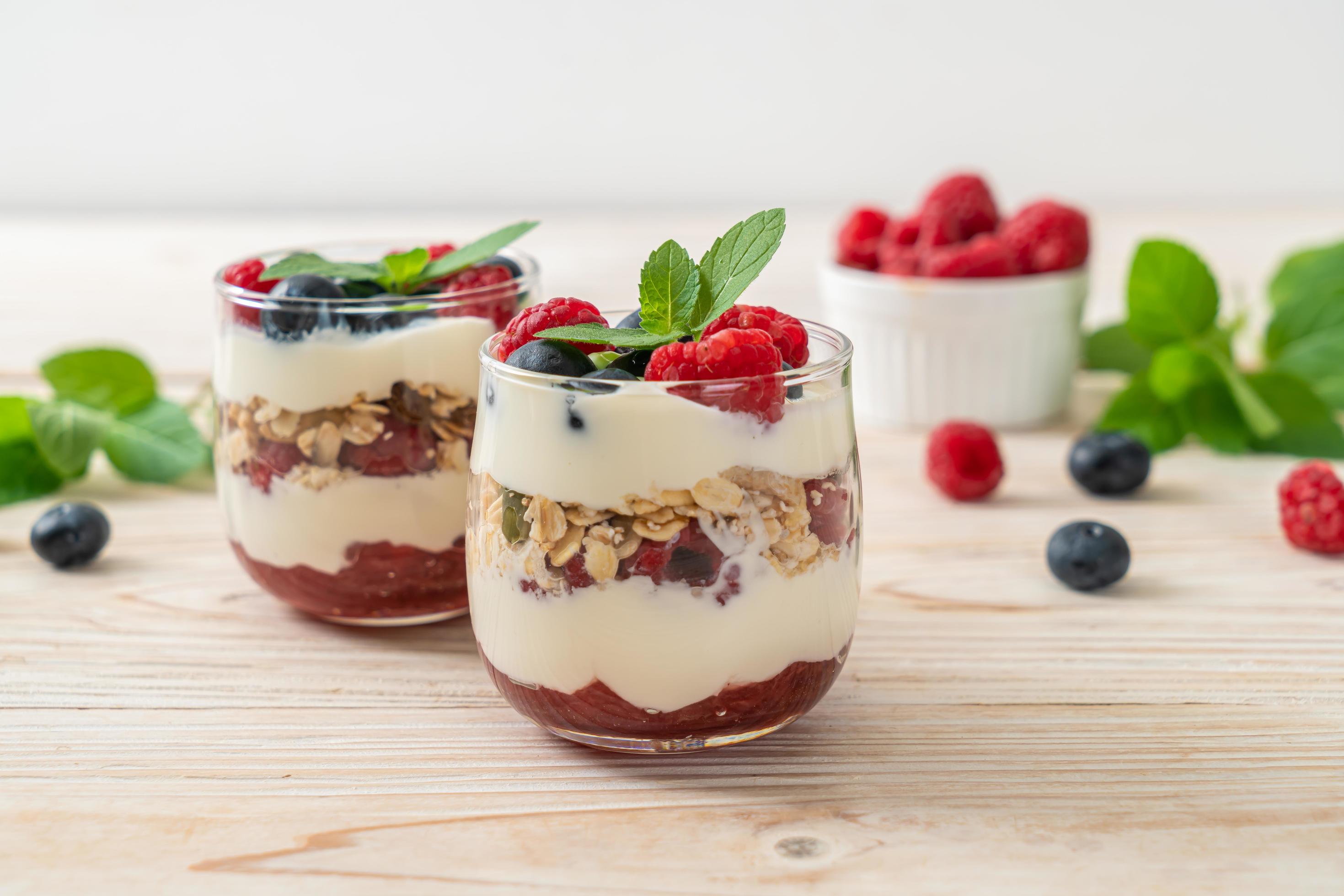 Homemade raspberry and blueberry with yogurt and granola – healthy food style Stock Free