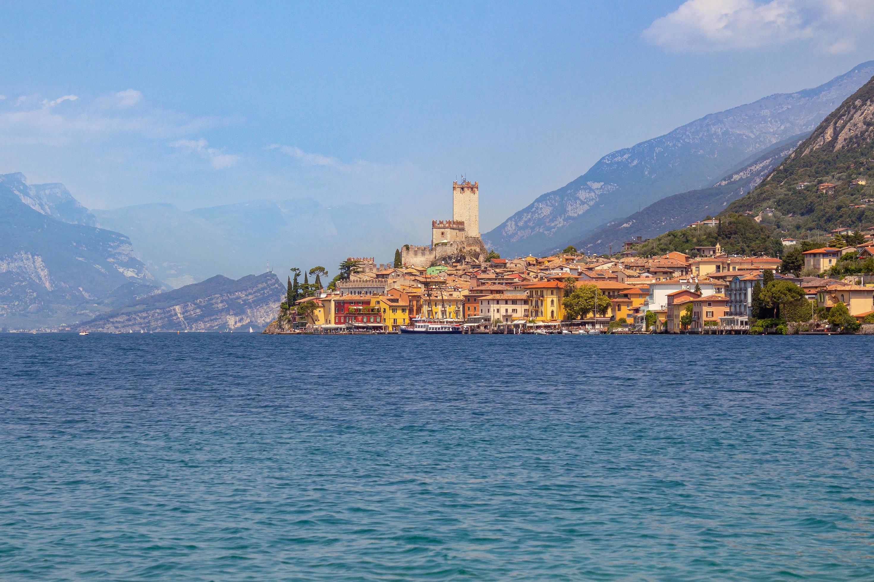 View from lakeside walkway to famous mediterrean town Malcesine, Lago di Garda Garda lake, Italy Stock Free