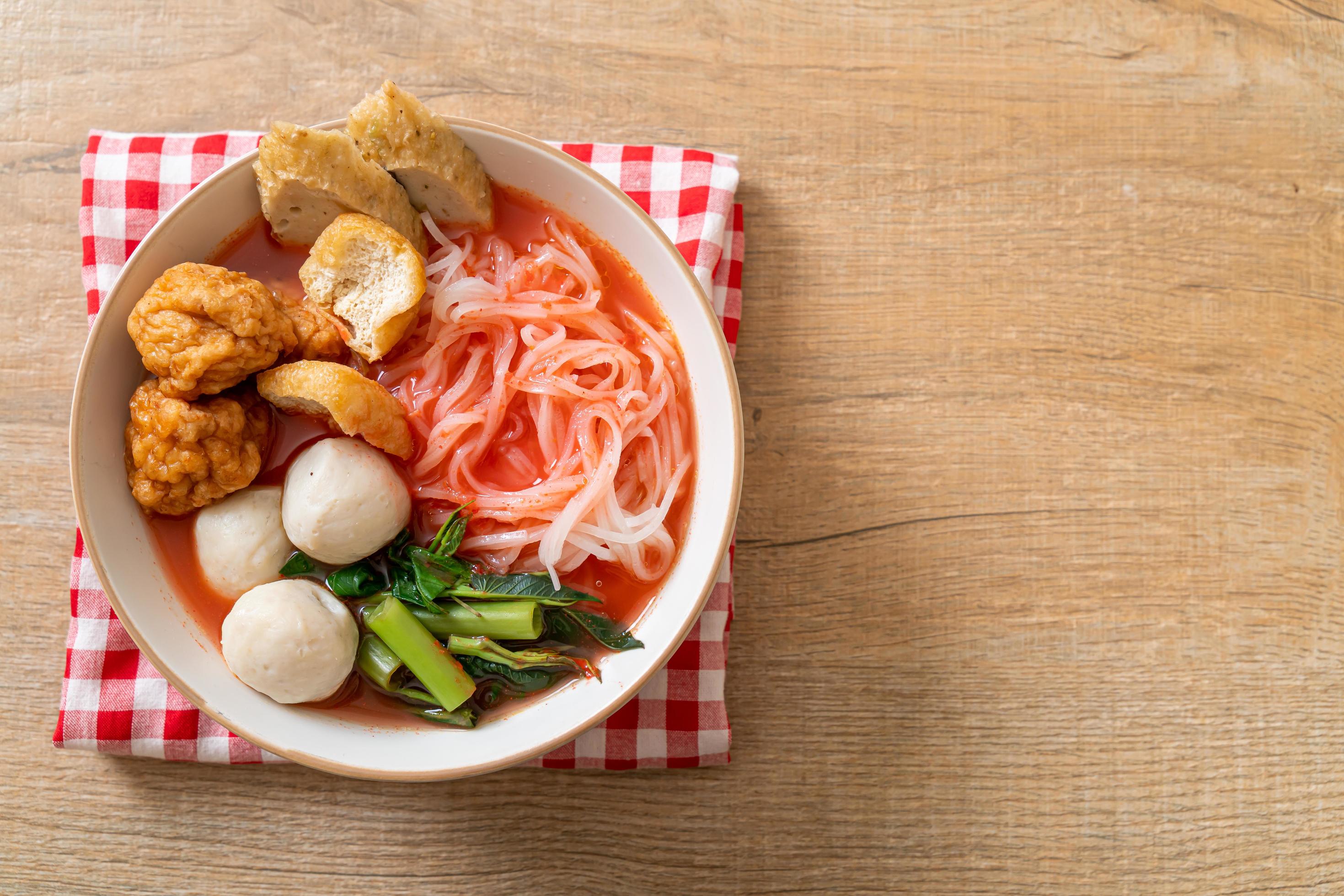 Small flat rice noodles with fish balls and shrimp balls in pink soup, Yen Ta Four or Yen Ta Fo – Asian food style Stock Free