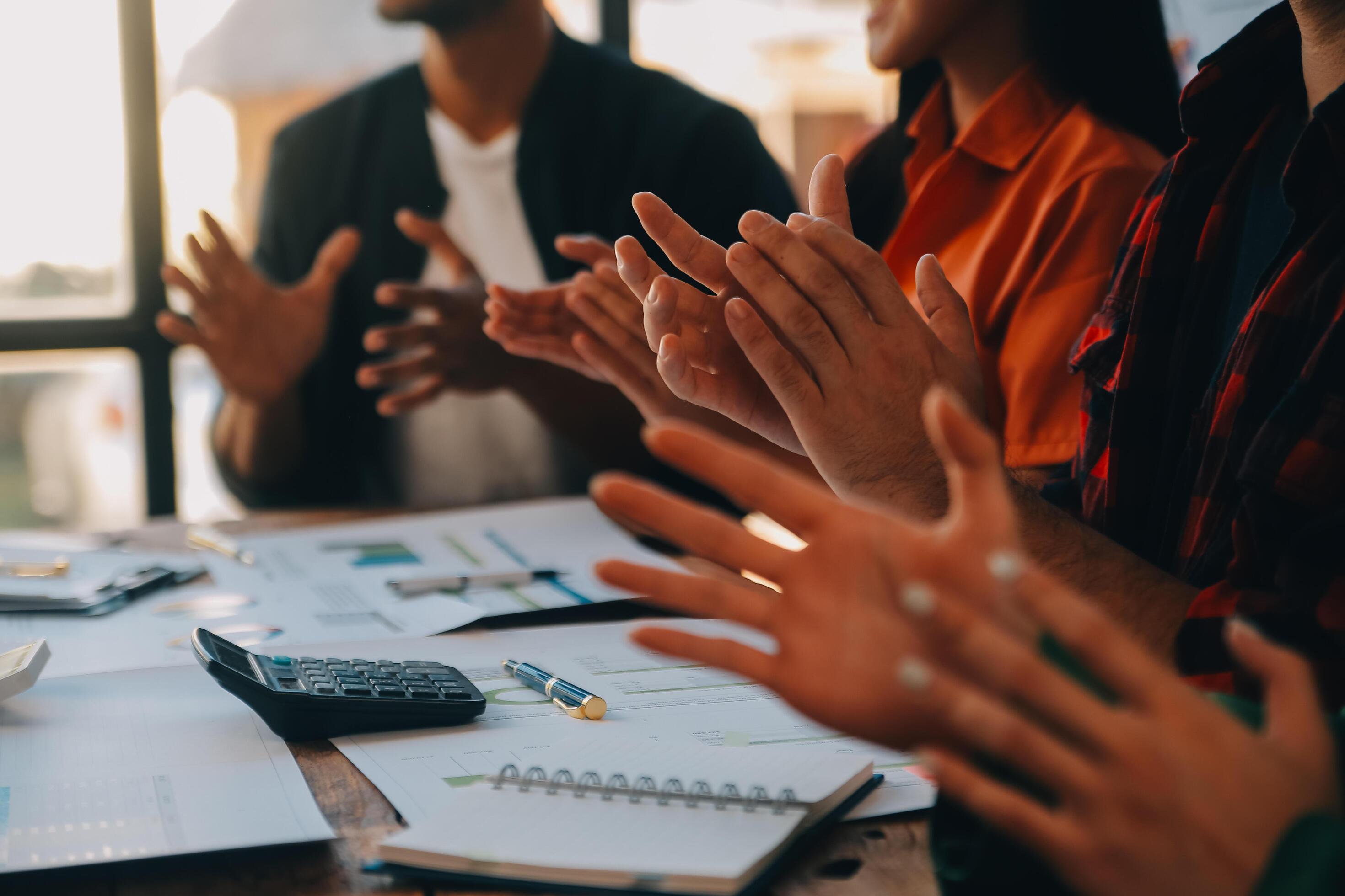 
									Cheerful business colleagues applauding in meeting at coworking office Stock Free