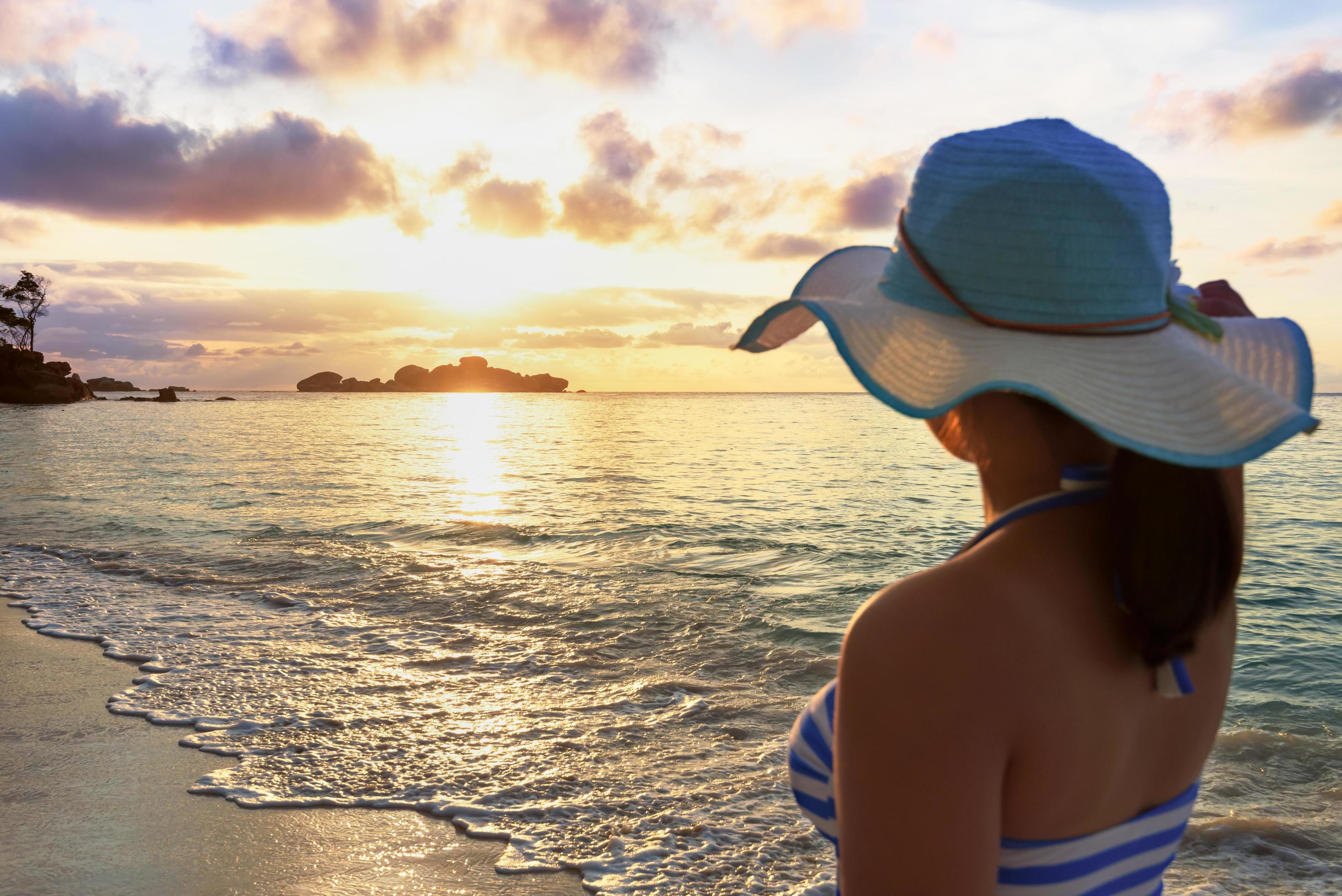 Girl on the beach at sunrise Stock Free