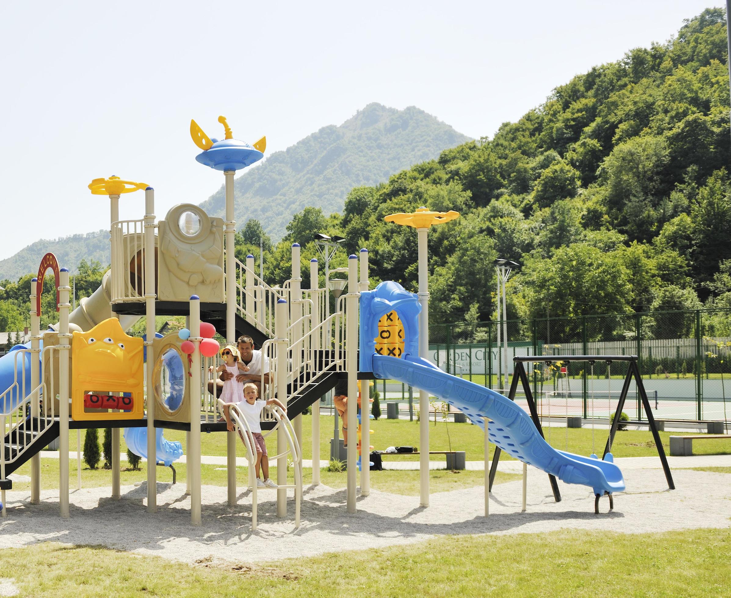 family portrait at park playground Stock Free