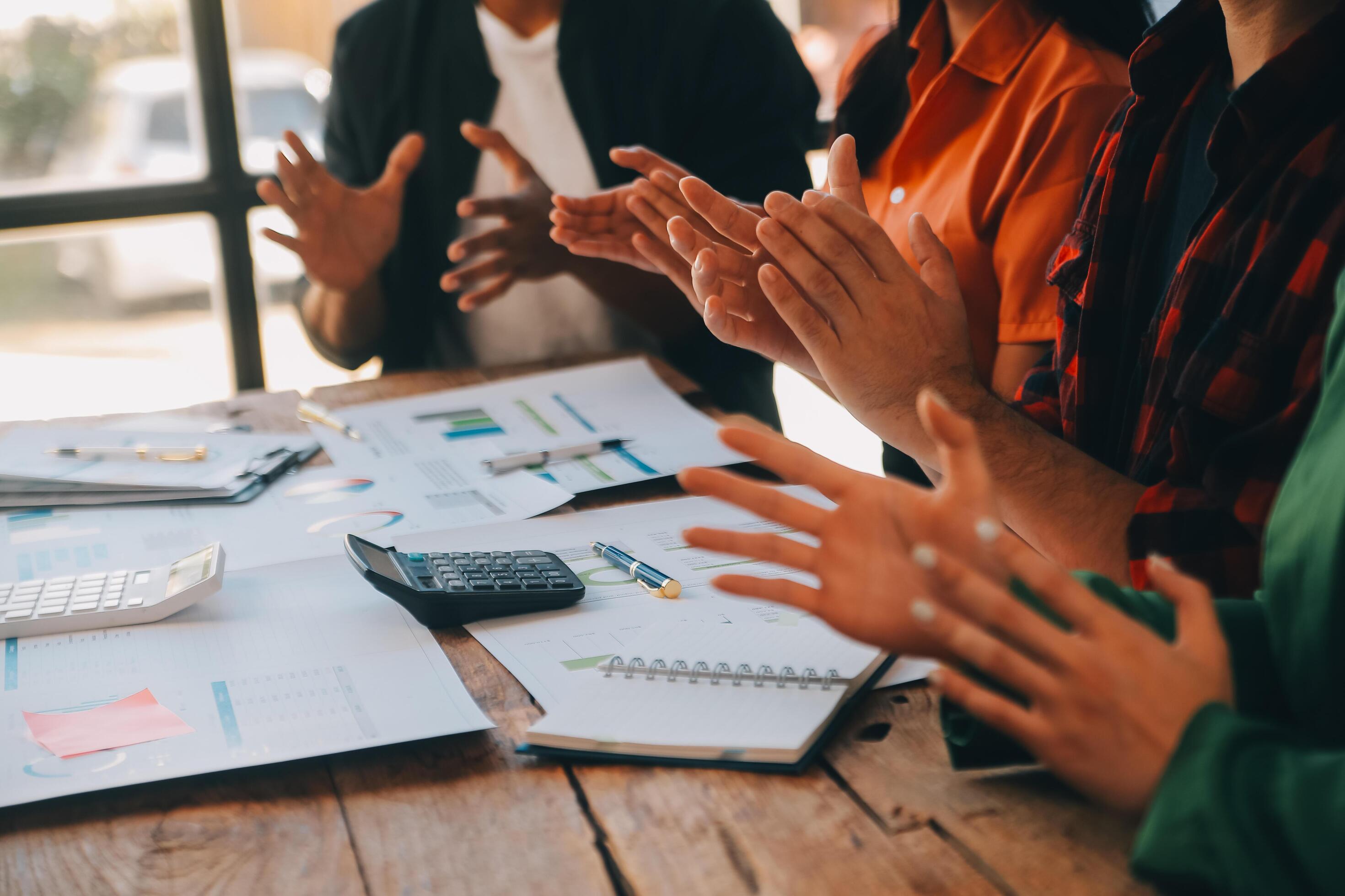 
									Cheerful business colleagues applauding in meeting at coworking office Stock Free