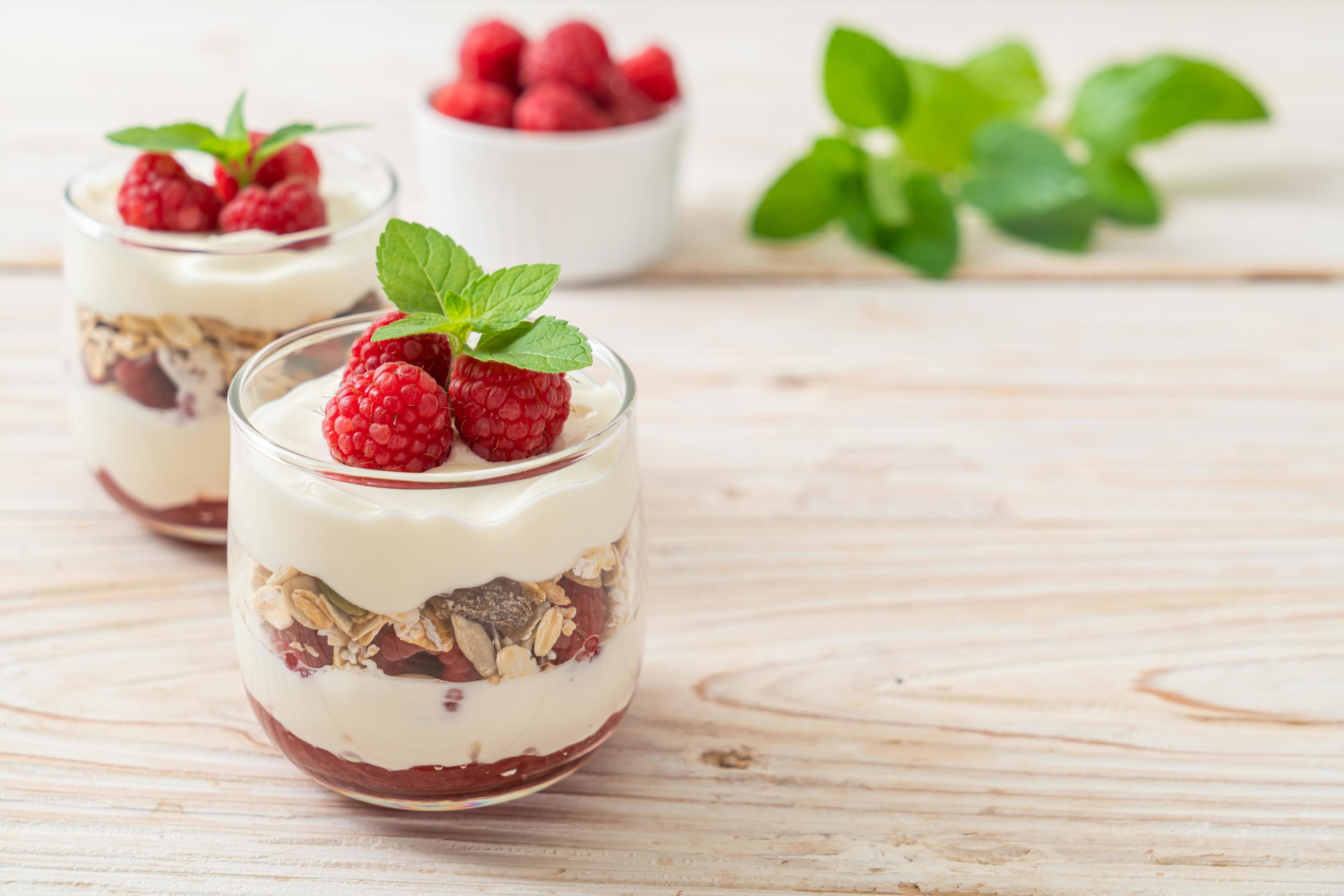 Fresh raspberry and yogurt with granola – Healthy food style Stock Free