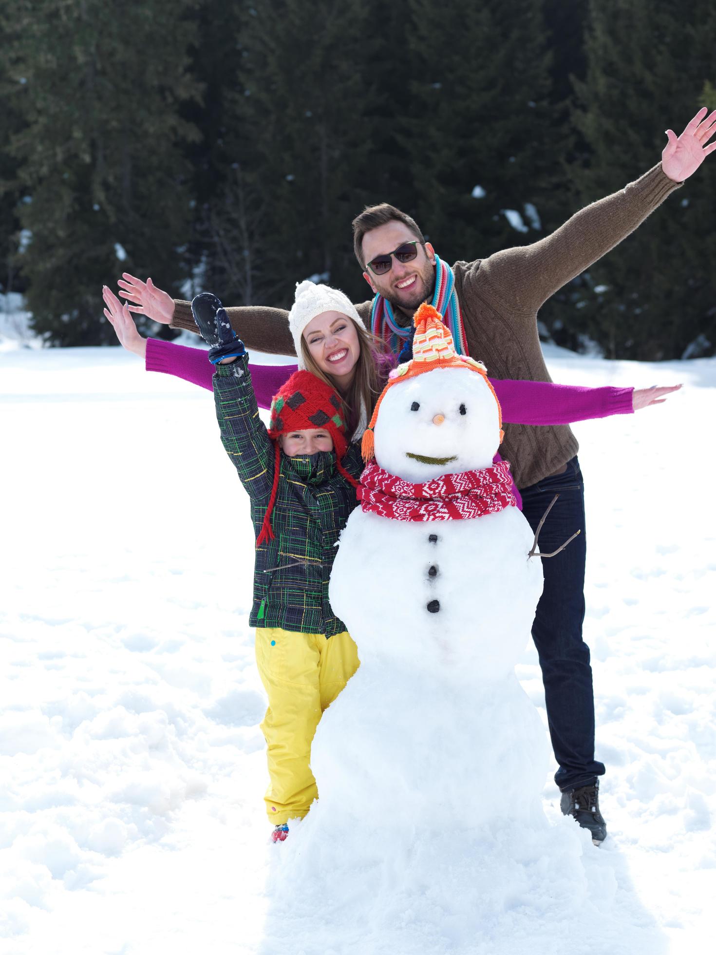 happy family making snowman Stock Free