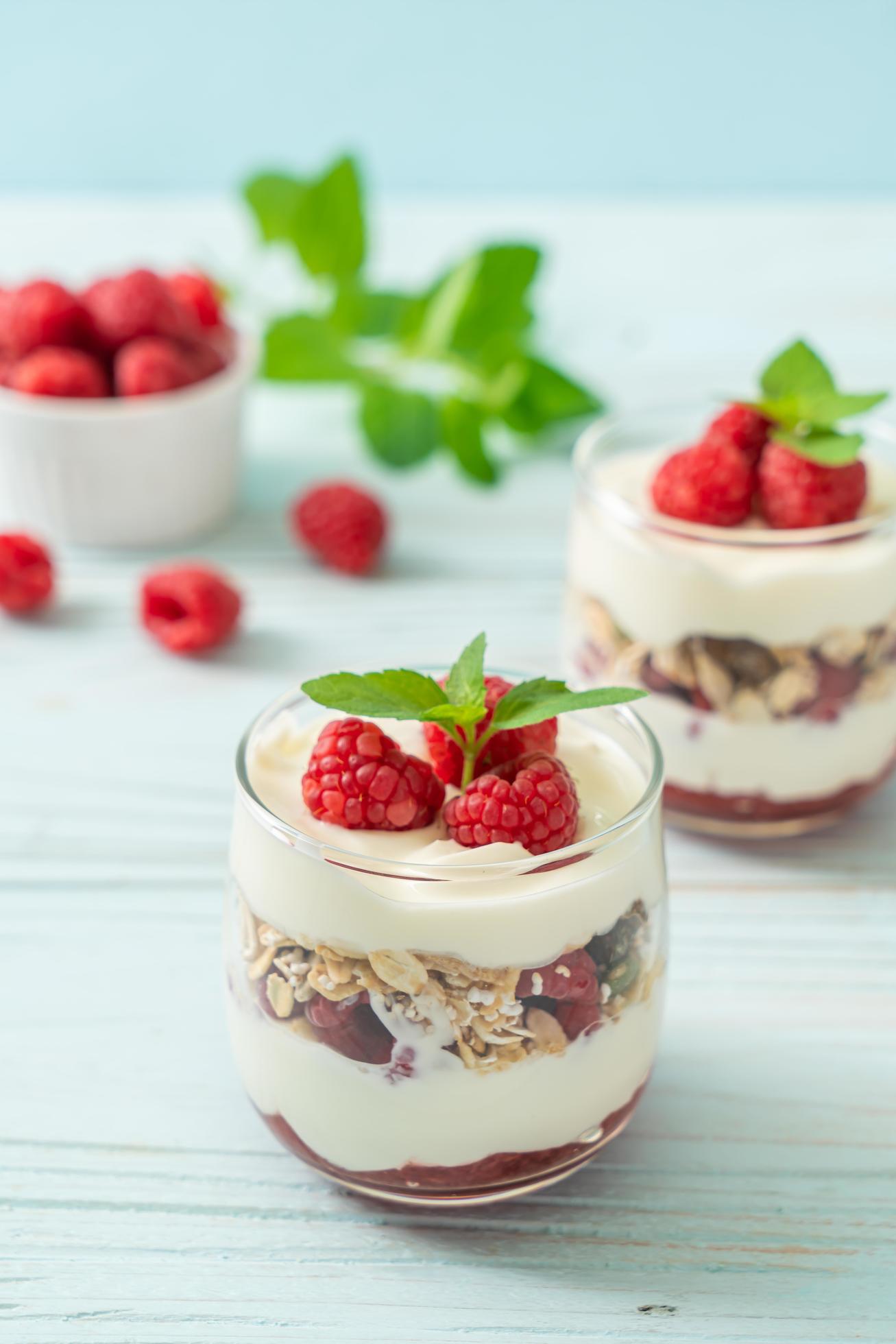 Fresh raspberry and yogurt with granola – Healthy food style Stock Free