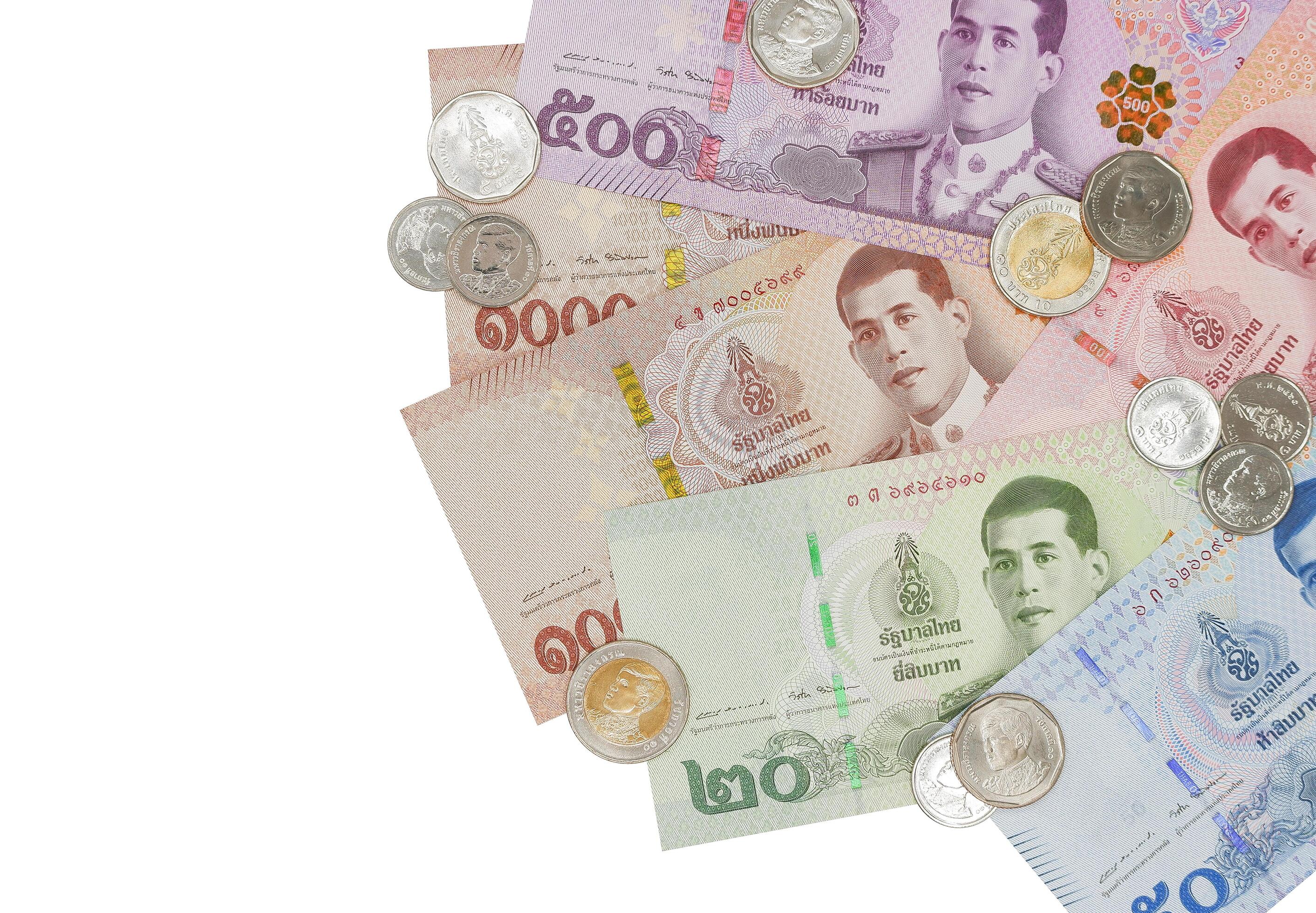 Pile of Thai Baht banknotes and coins. Business and finance concept. Stock Free