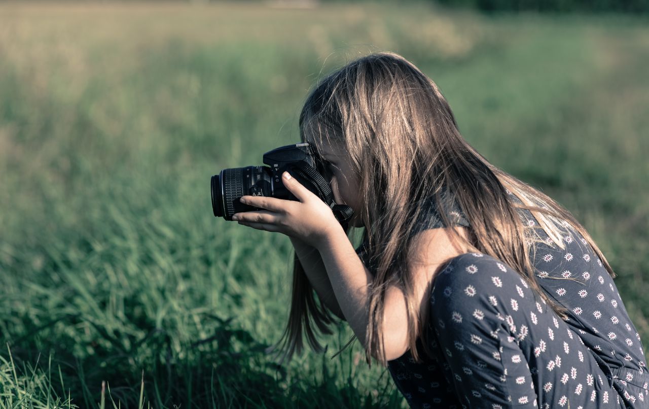 Girl taking a photo Stock Free