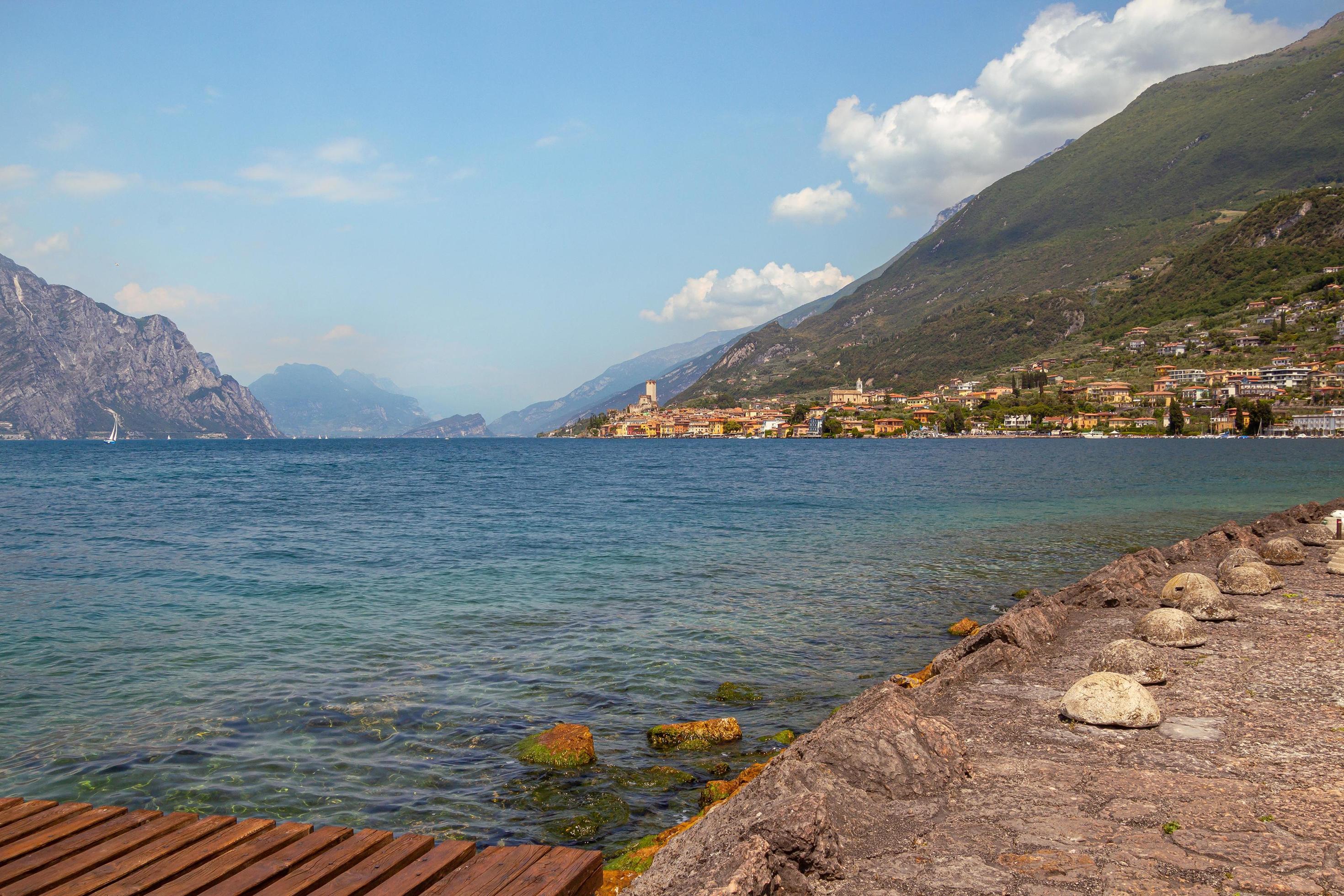 View from lakeside walkway to famous mediterrean town Malcesine, Lago di Garda Garda lake, Italy Stock Free