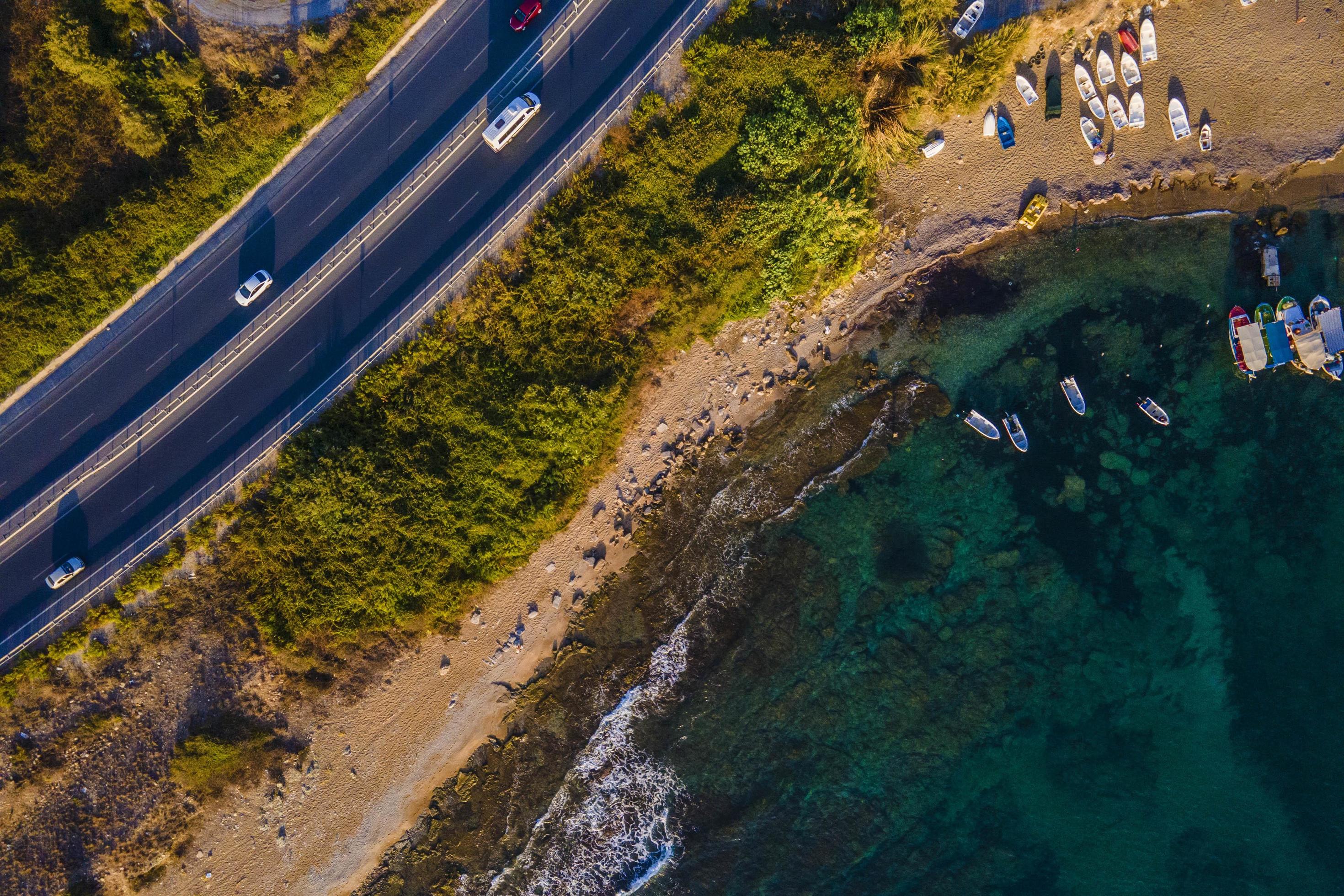 from the air. Waves float to the rocky shore. Stock Free