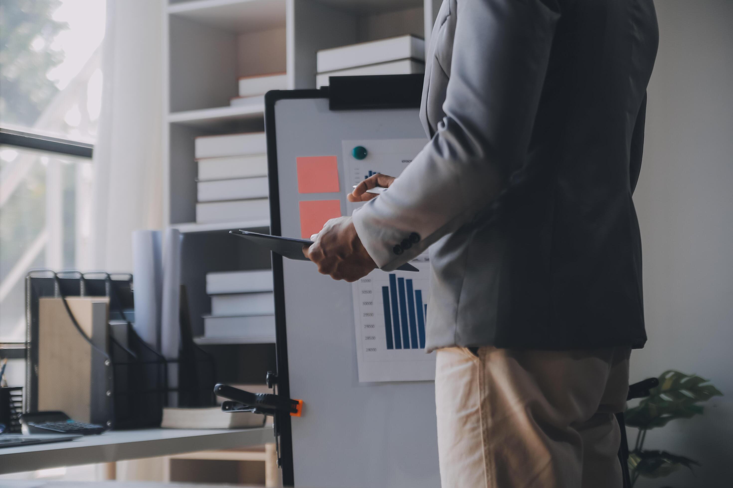 Close up of Business team analyzing income charts and graphs with modern laptop computer. Business analysis and strategy concept. Stock Free